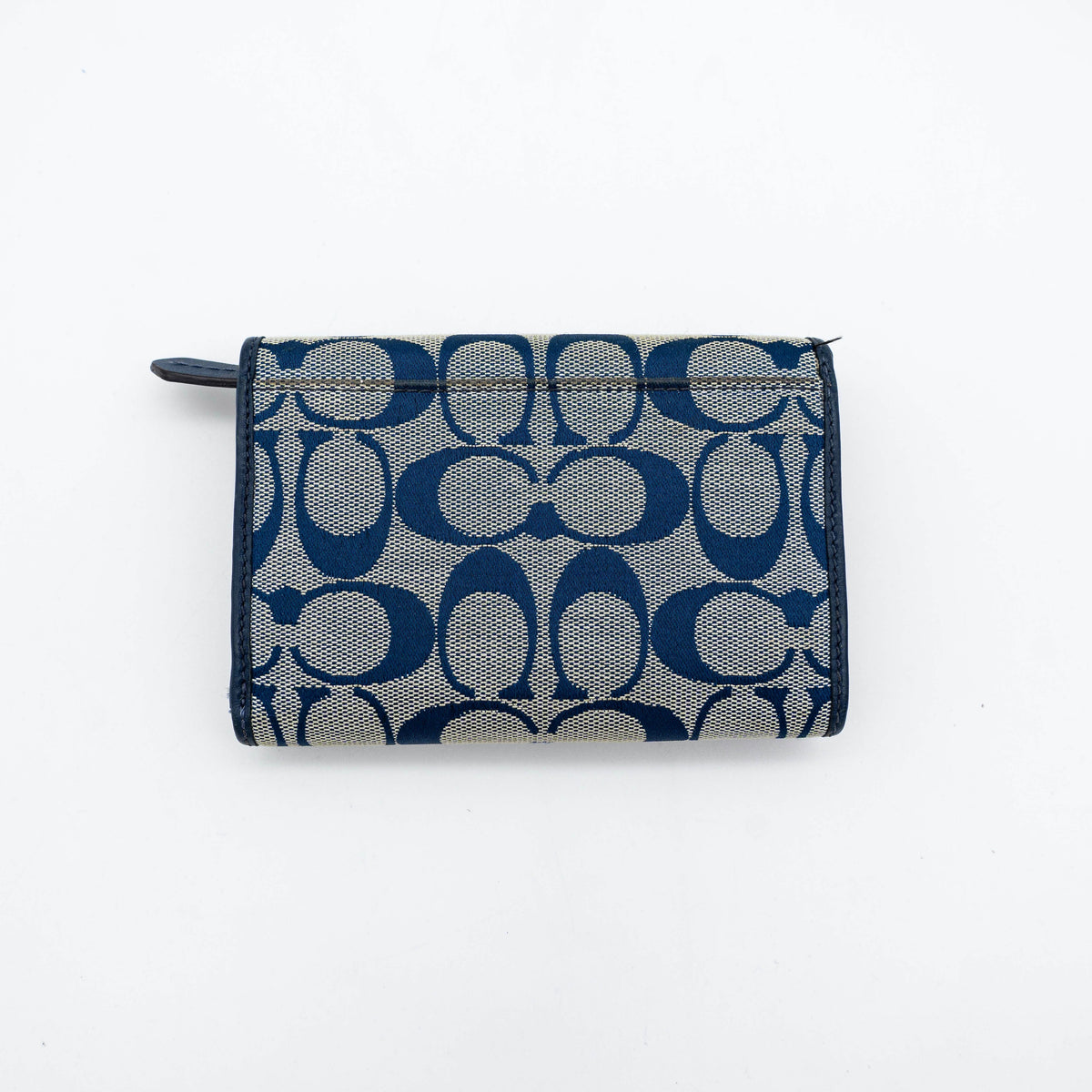 Coach Signature Ashley compact wallet in blue jacquard with leather trim, featuring a silver logo and organized interior.