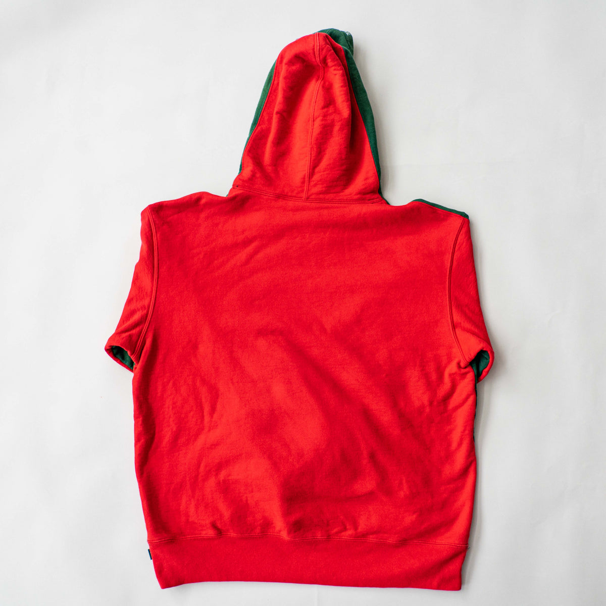 Supreme S Logo Split Hooded Sweatshirt in dark green and red, featuring front 'S' patch and a bold colour contrast.