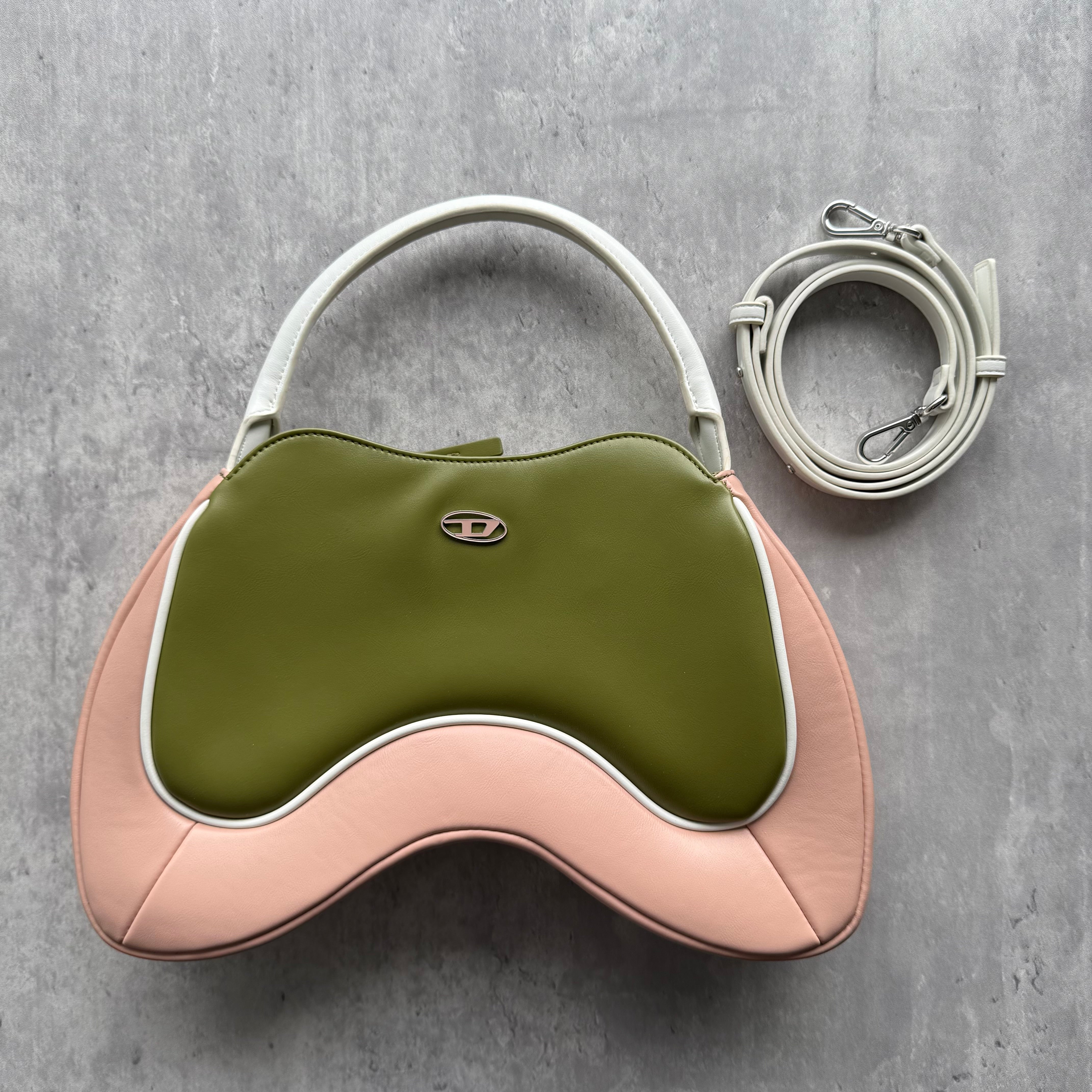 Diesel 2Way Autre Marque Shoulder Bag in green and pink leather, featuring a curved silhouette, silver-tone logo, and detachable strap