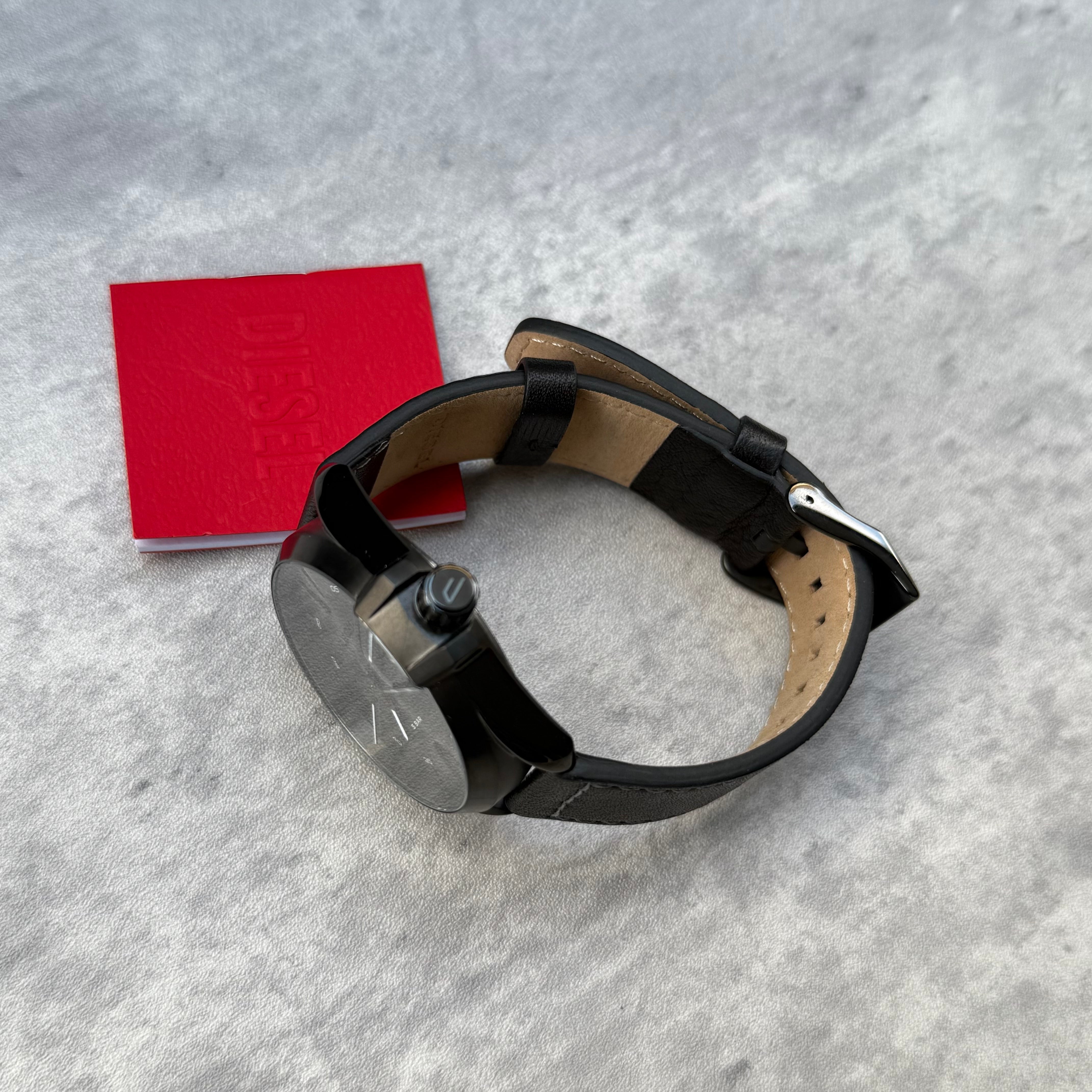 Pre-loved Diesel DZ1924 MS9 three-hand black leather watch with silver-tone dial, shown with original box and booklet