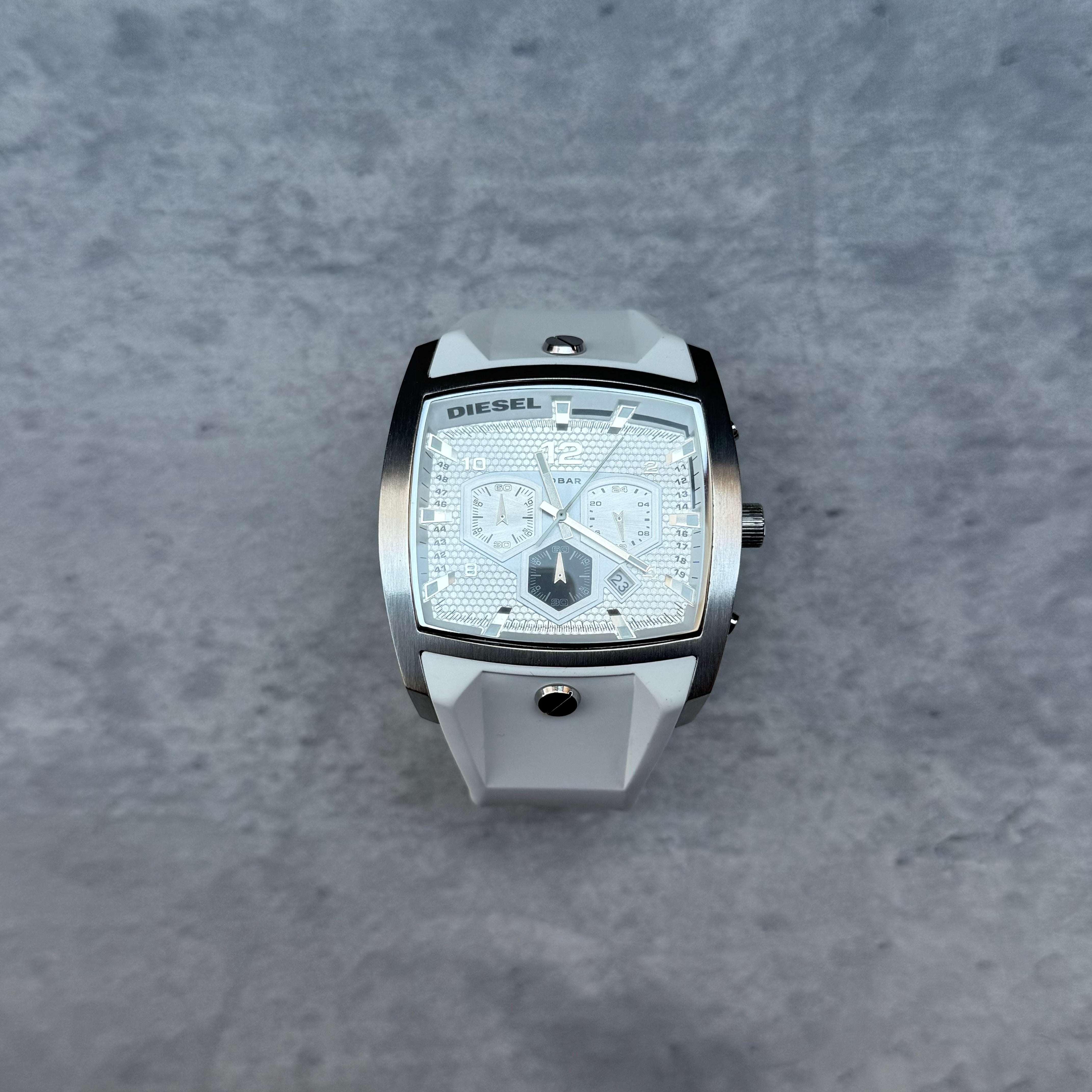 Diesel DZ4163 Chronograph Watch White, featuring stainless steel square case, textured dial, and white silicone strap.