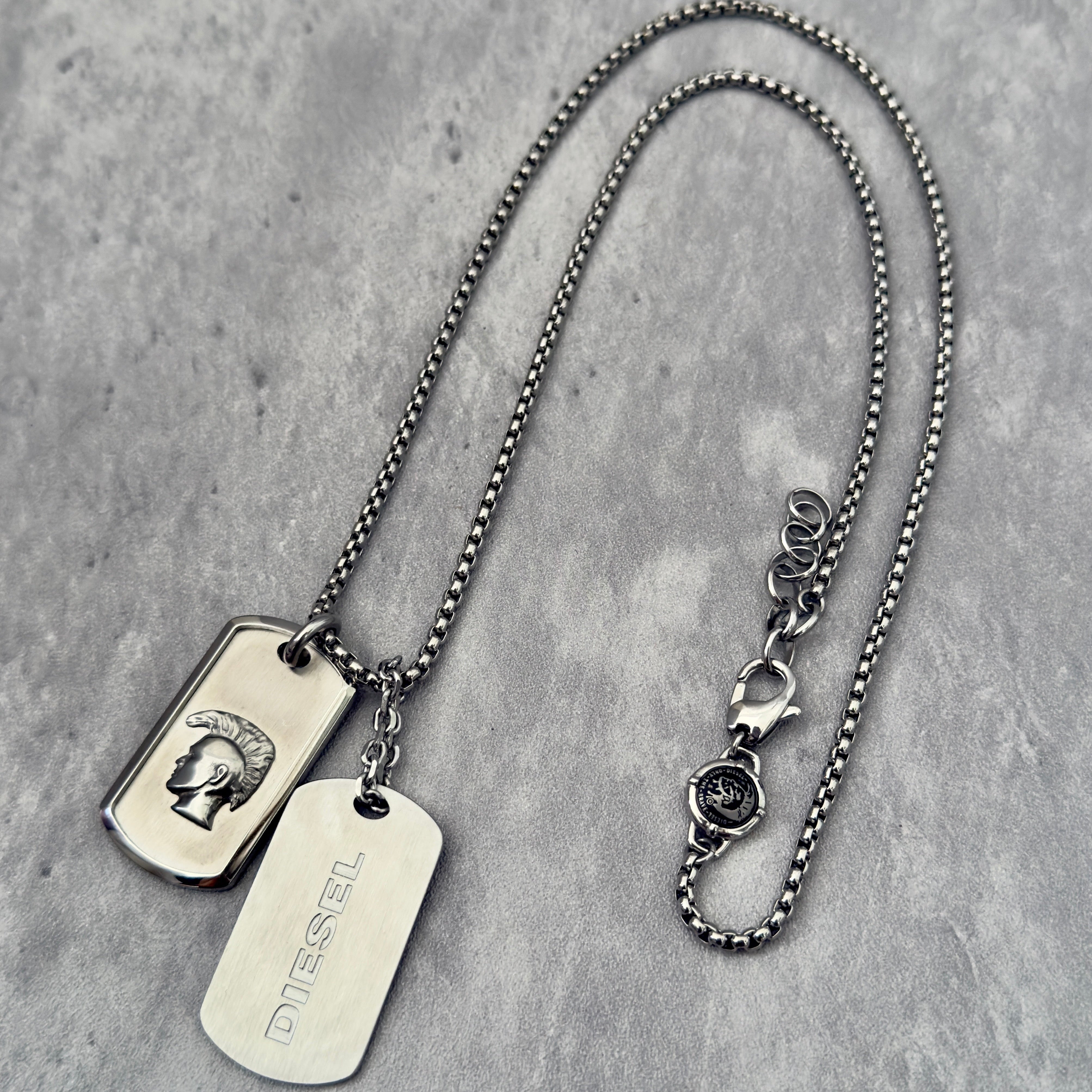 Diesel Double Plate Dog Tag Pendant Necklace in silver-tone stainless steel, featuring a Mohawk head engraving and Diesel logo.