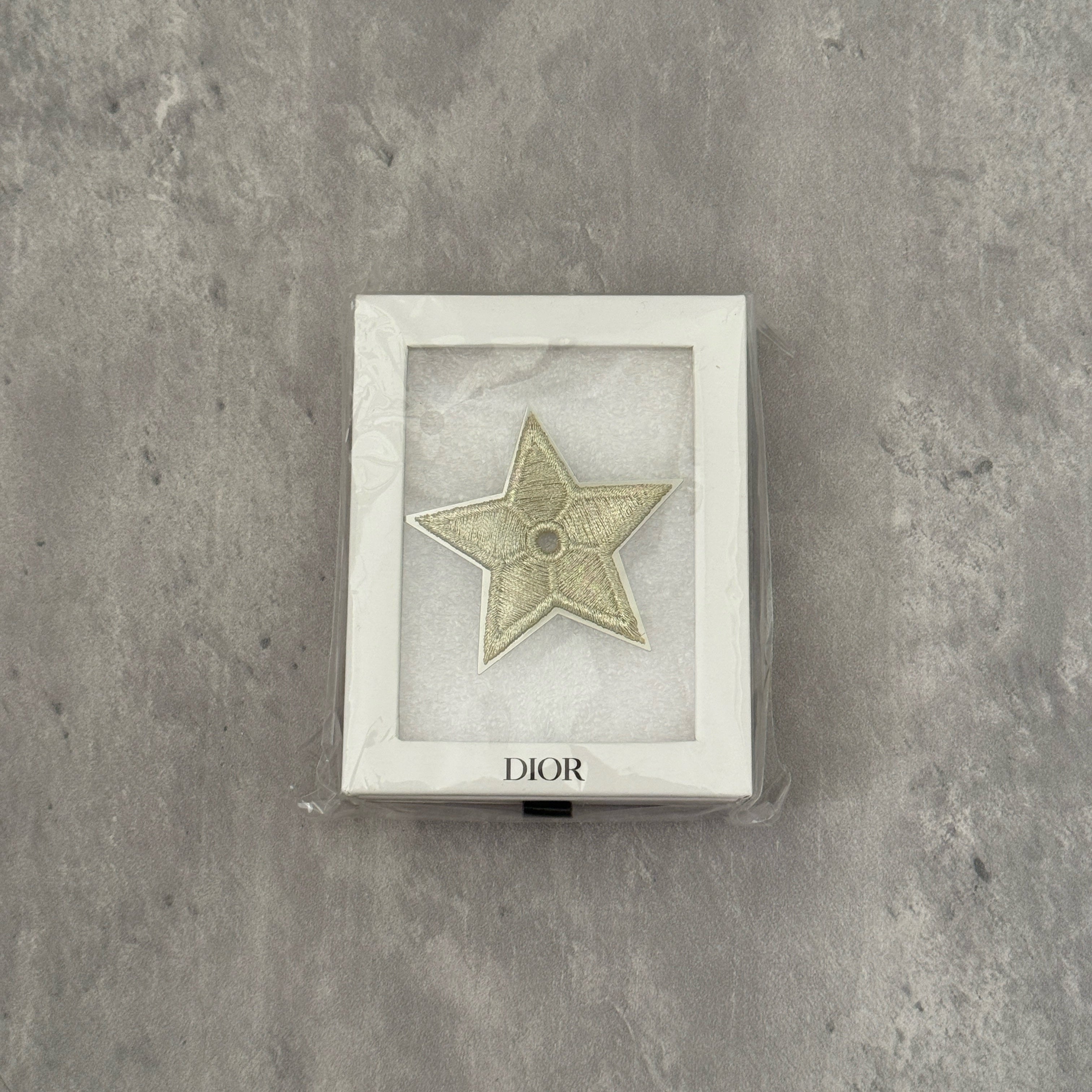 Dior Vintage Star Pin with embroidered gold-tone detailing, silver-tone backing, and original Dior Beauté engraving.
