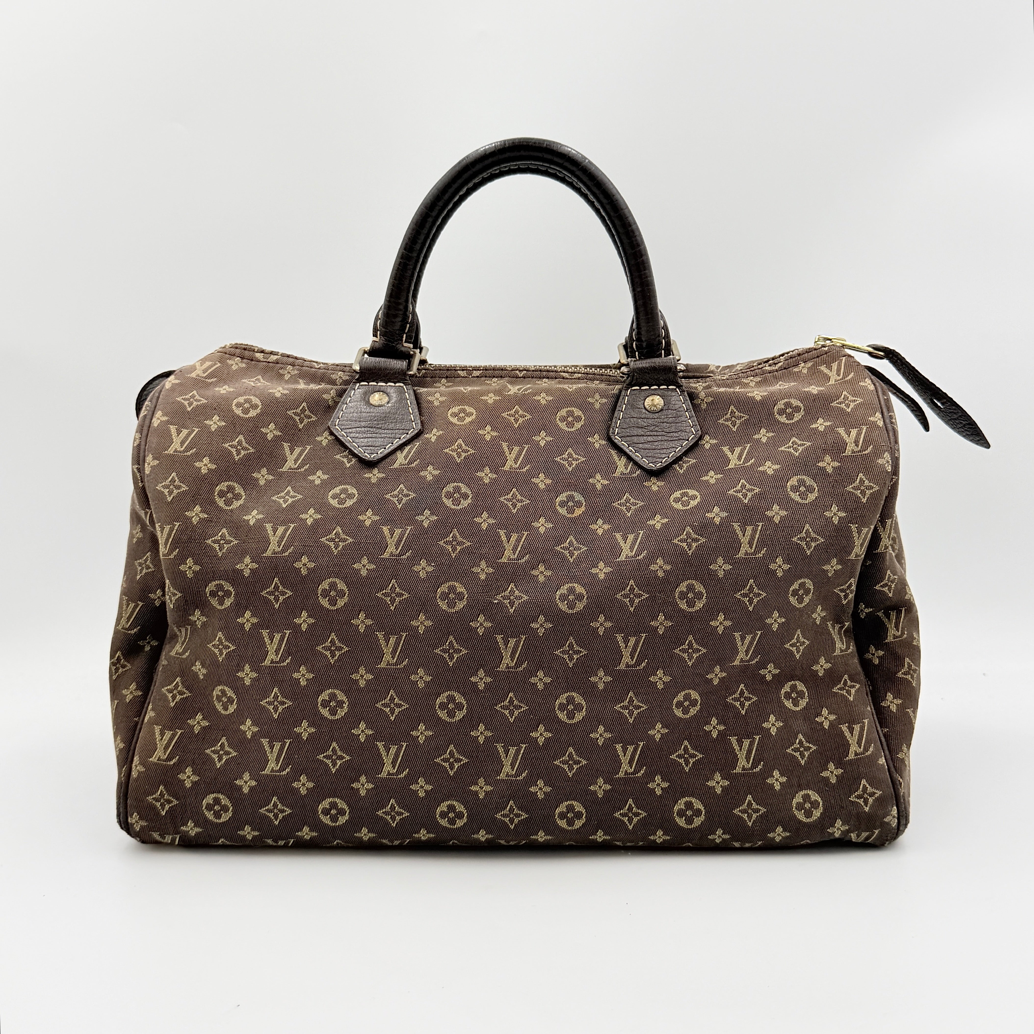 Louis Vuitton Monogram Mini Lin Speedy 30 in brown textile with top handles and monogram motif, shown against a white background.