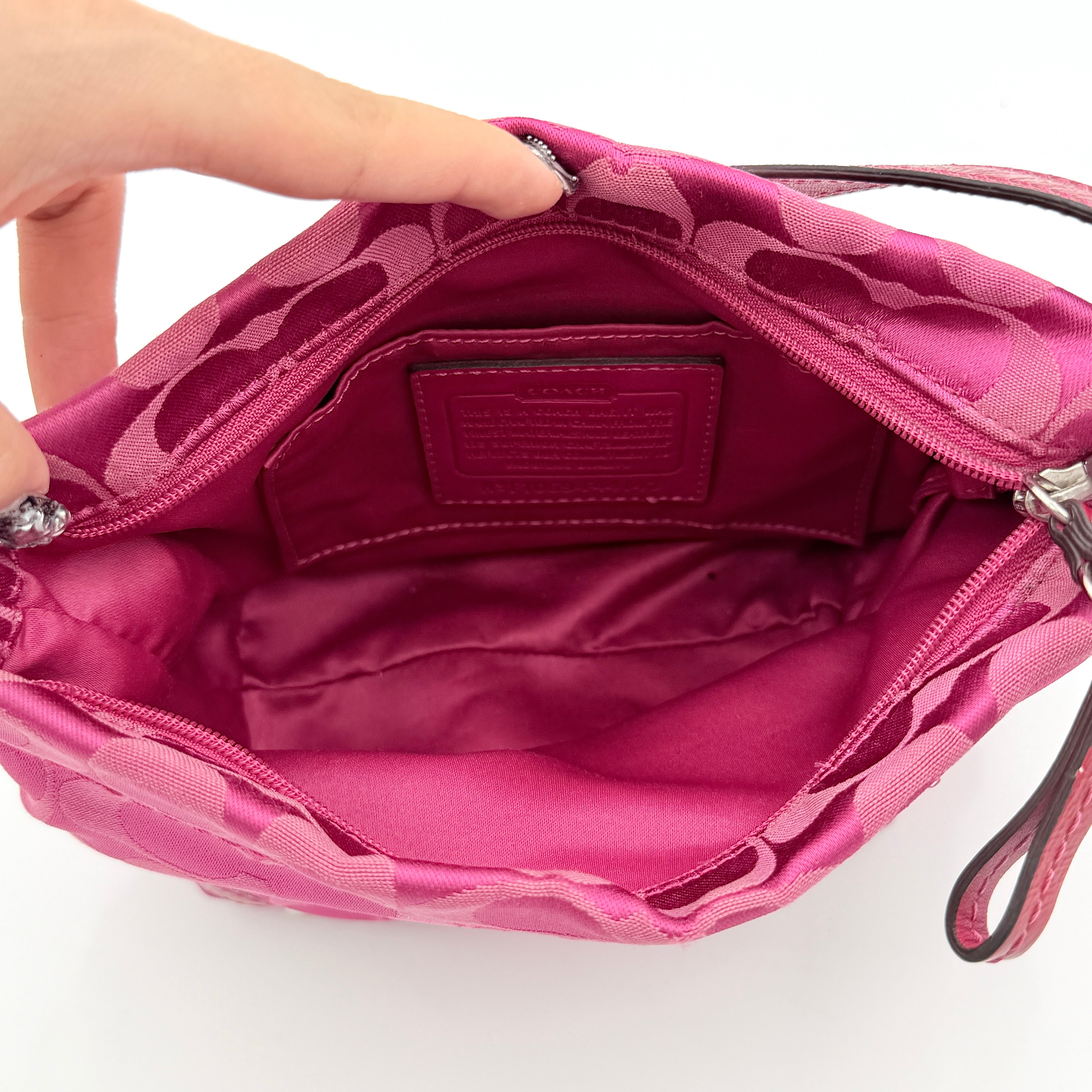 Coach Carly Hobo Shoulder Bag in vivid pink jacquard and leather, featuring signature chain detail and silver hardware.