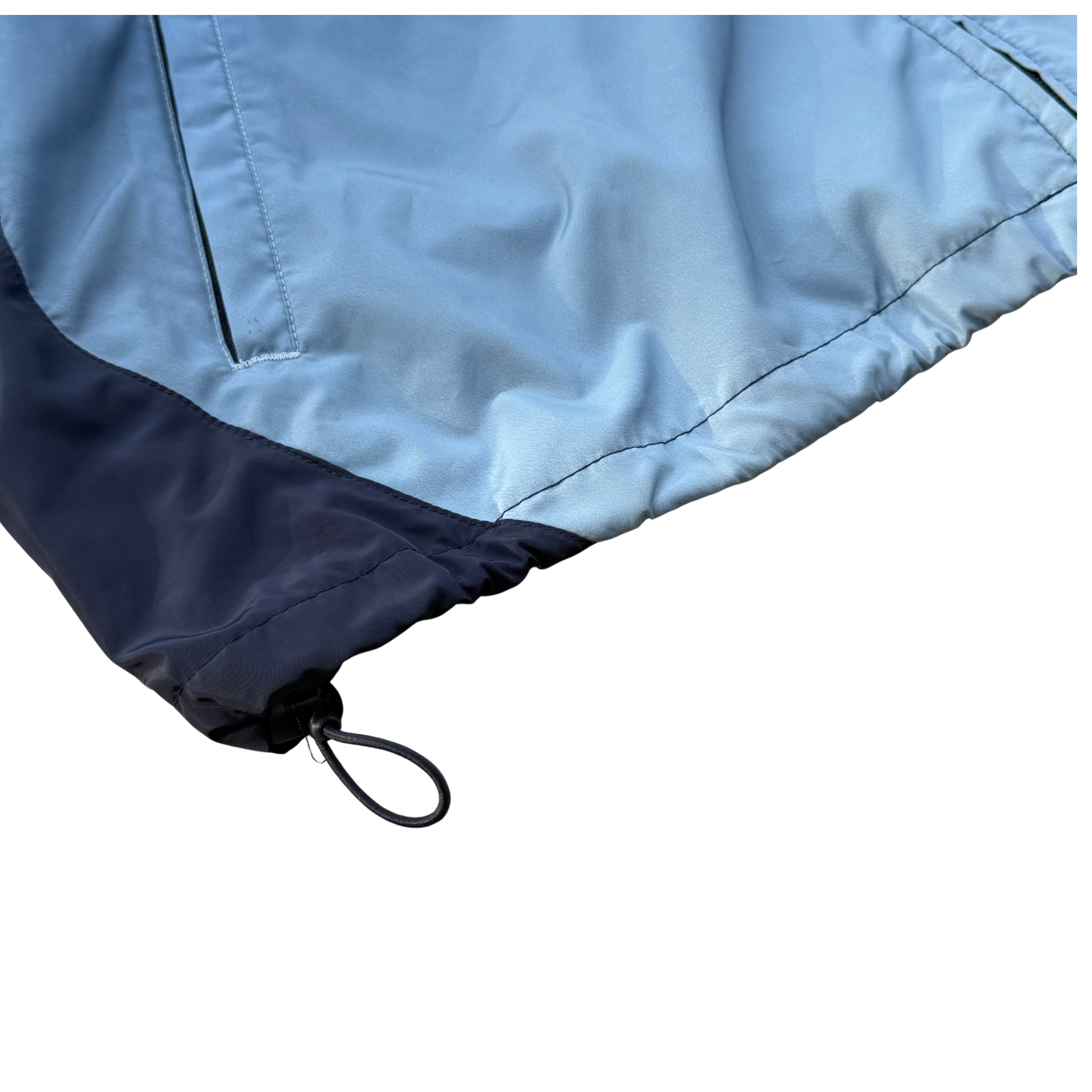 Supreme x Umbro blue gradient track jacket with white Supreme Champions lettering and crest, shown zipped with elastic cuffs and hem.