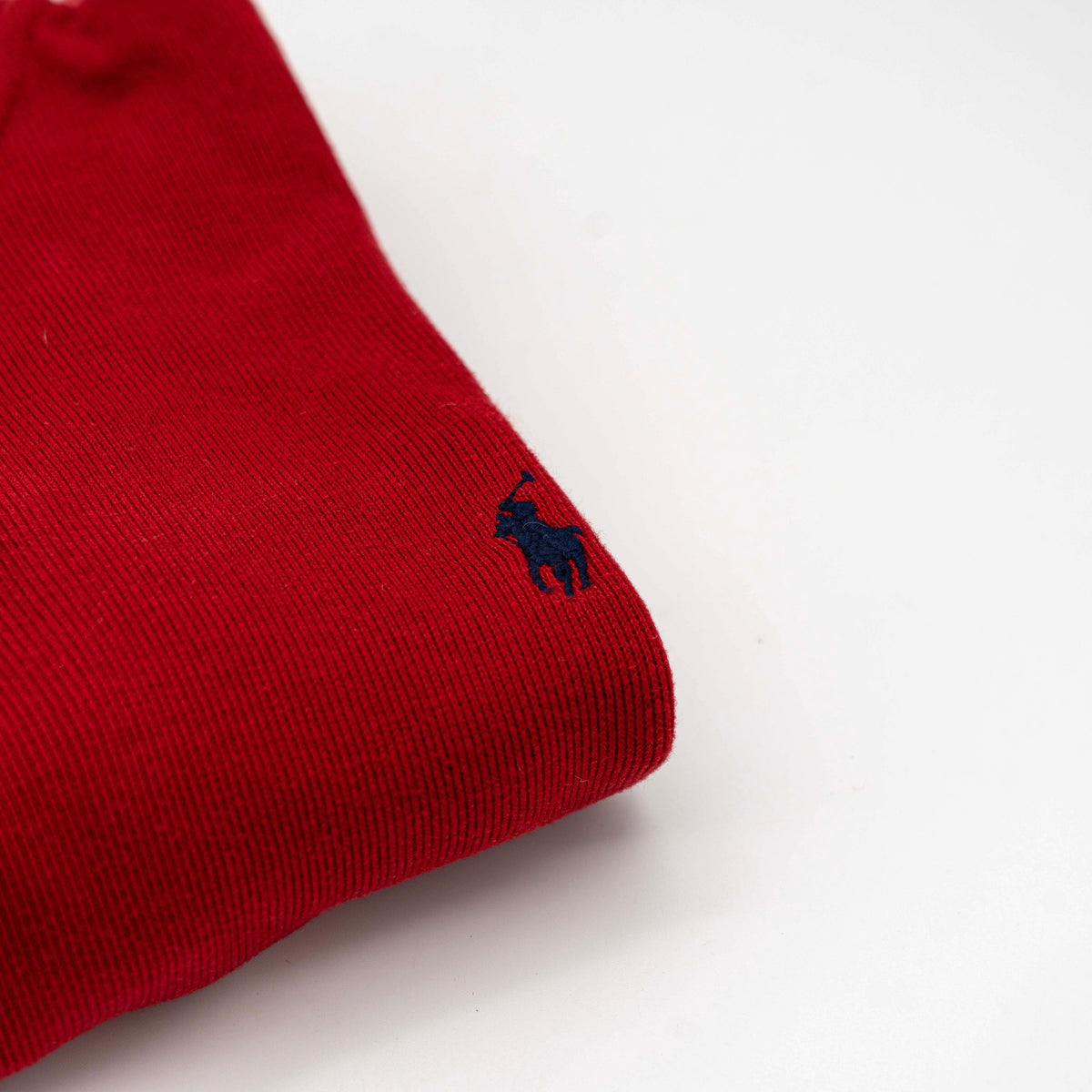 Polo Ralph Lauren red quarter zip mockneck pullover sweater with navy pony embroidery, laid flat on a white background.