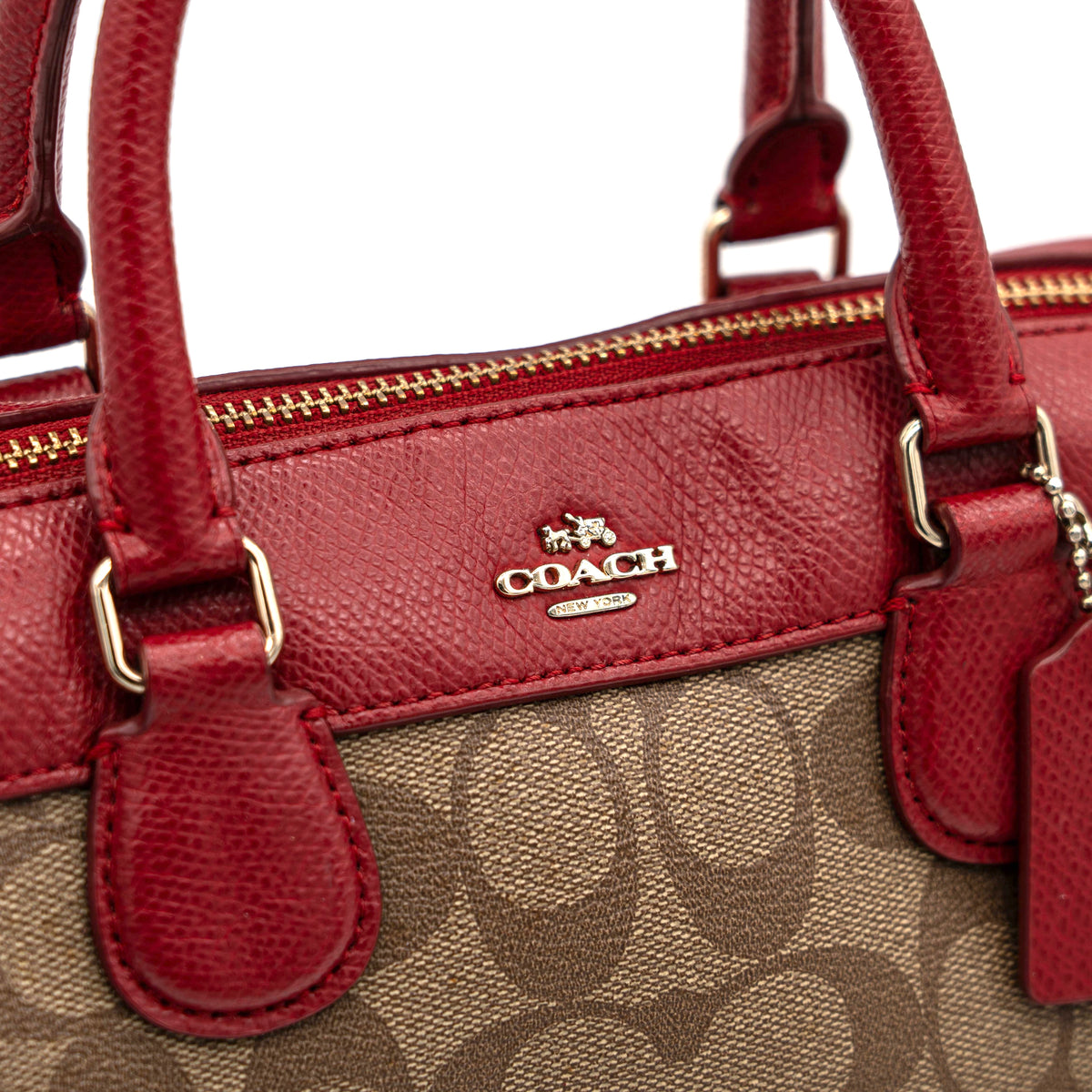 Coach Mini Bennett Boston bag in signature beige canvas with red leather trim, shown with detachable crossbody strap.