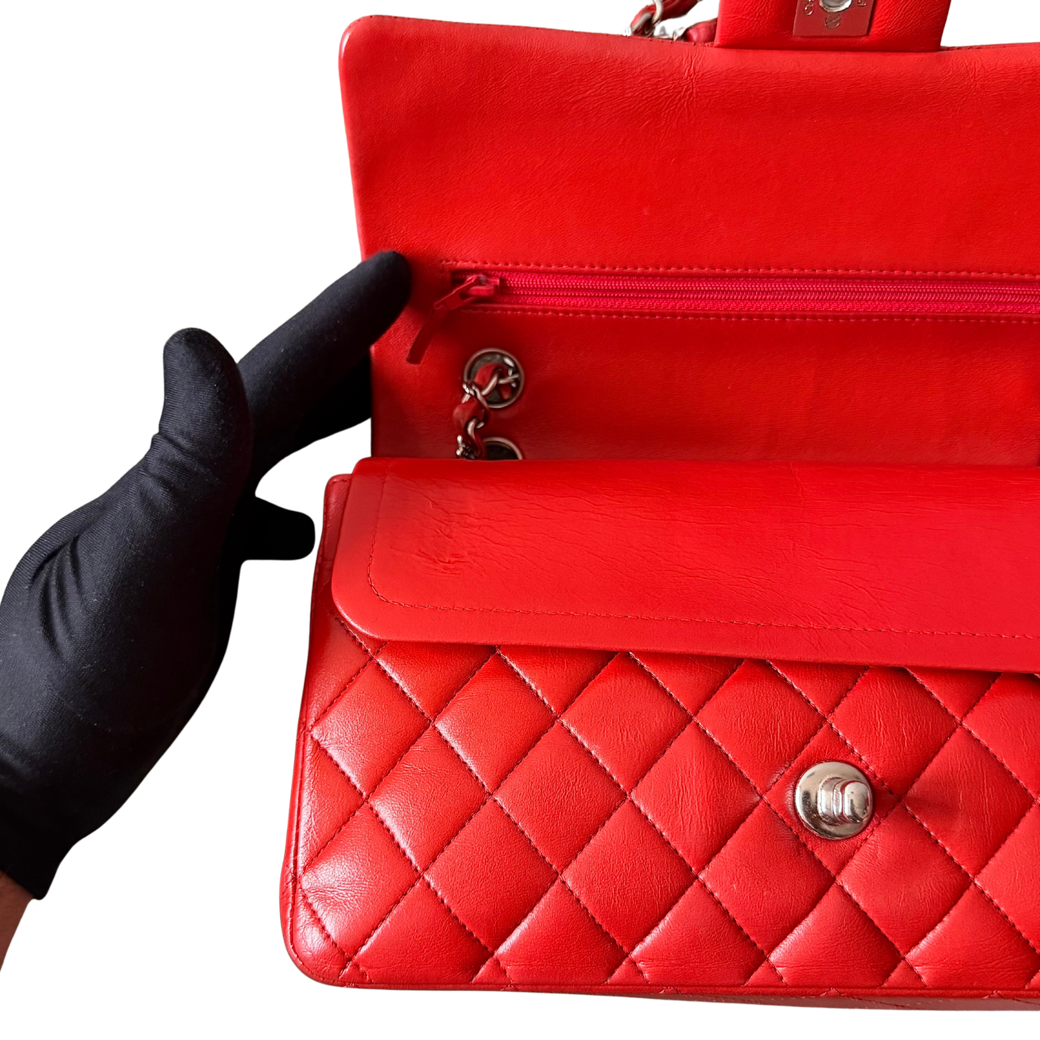 Chanel double flap shoulder bag in quilted red leather with silver-tone hardware and chain leather strap.