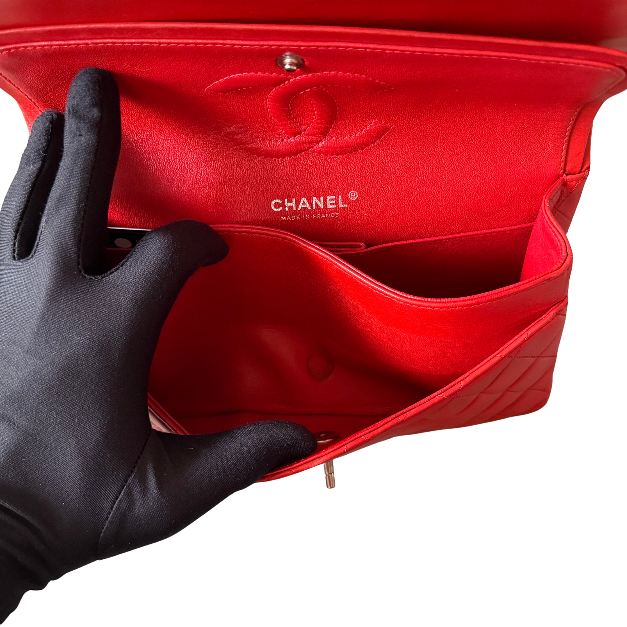 Chanel double flap shoulder bag in quilted red leather with silver-tone hardware and chain leather strap.