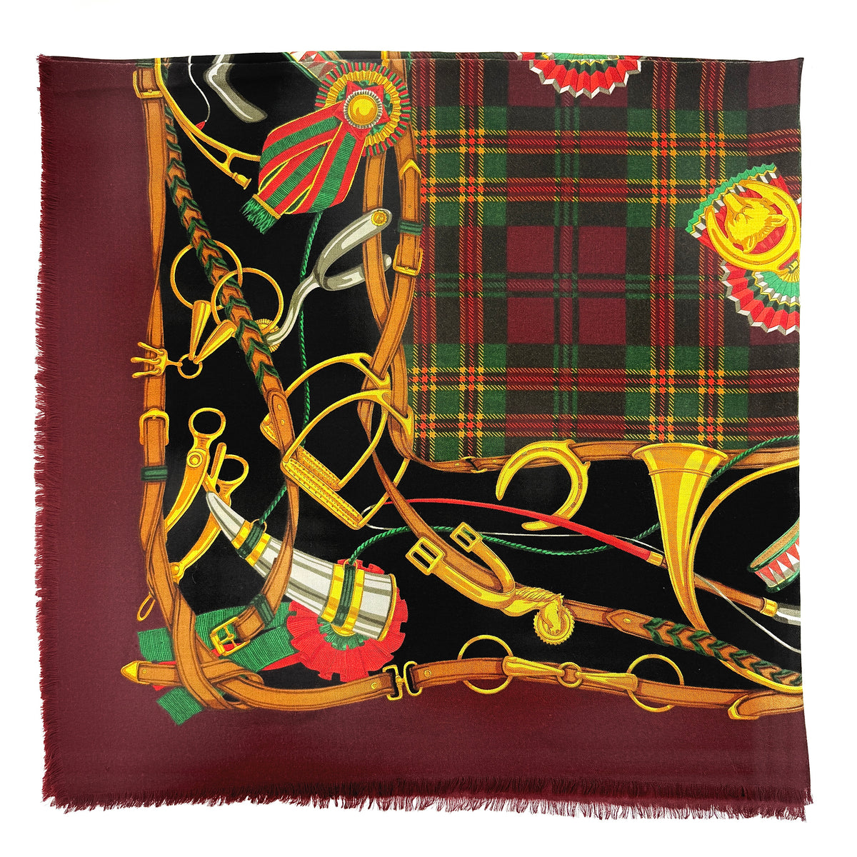 Gucci equestrian tartan shawl scarf in burgundy with heritage motifs and a fringed edge, styled folded.