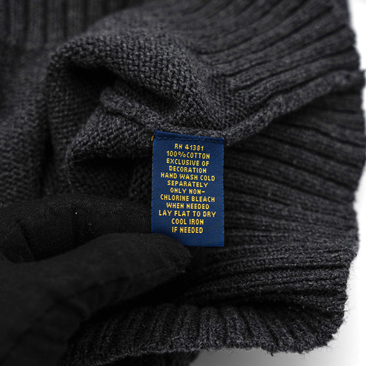 Dark grey Polo Ralph Lauren quarter zip mockneck pullover sweater with ribbed collar and green pony logo.