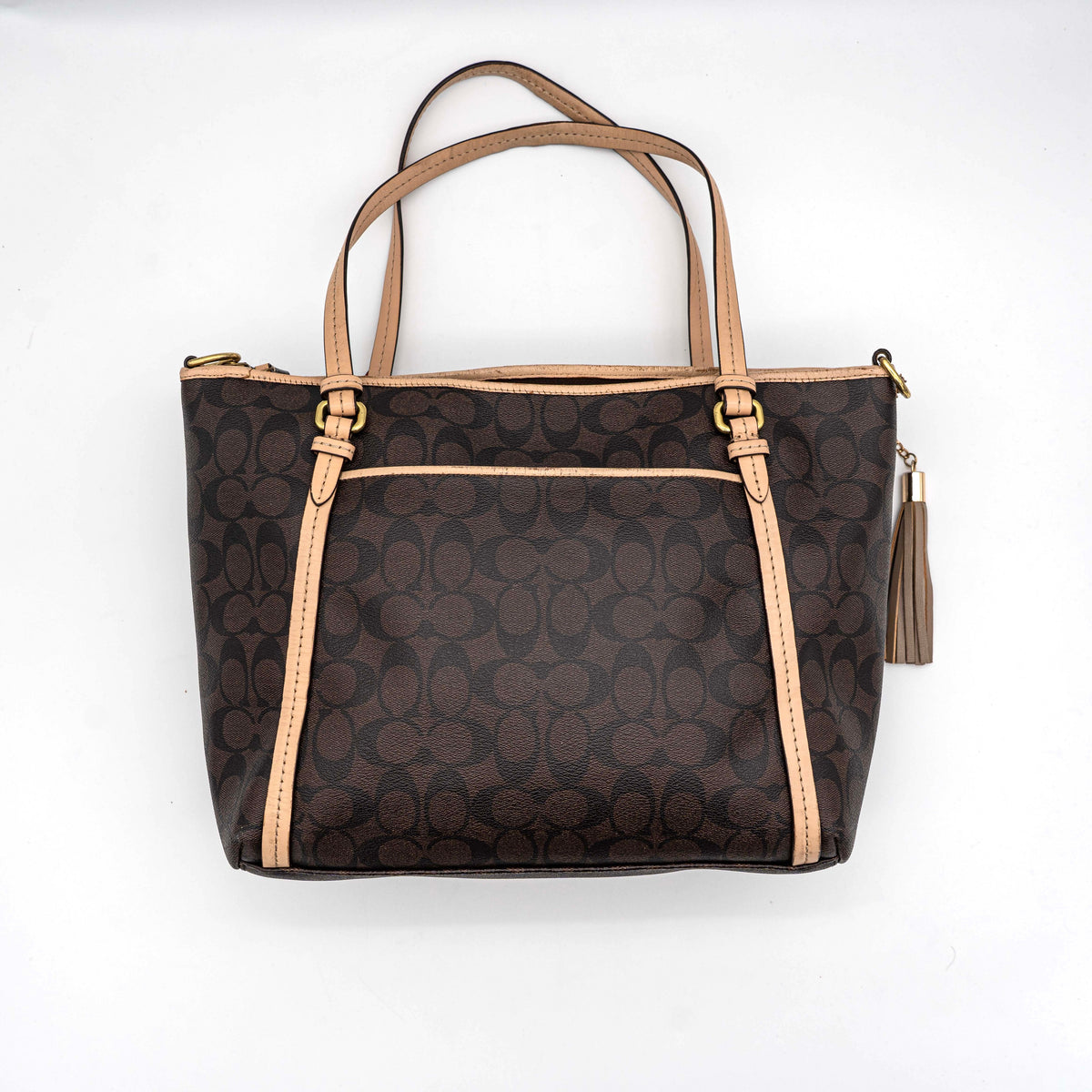 Coach Signature Peyton Pocket tote bag in brown canvas with tan leather trim, shown with both handles and detachable strap.