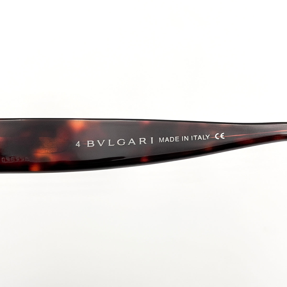Bvlgari 808 sunglasses in tortoiseshell brown acetate displayed with original case and cloth.