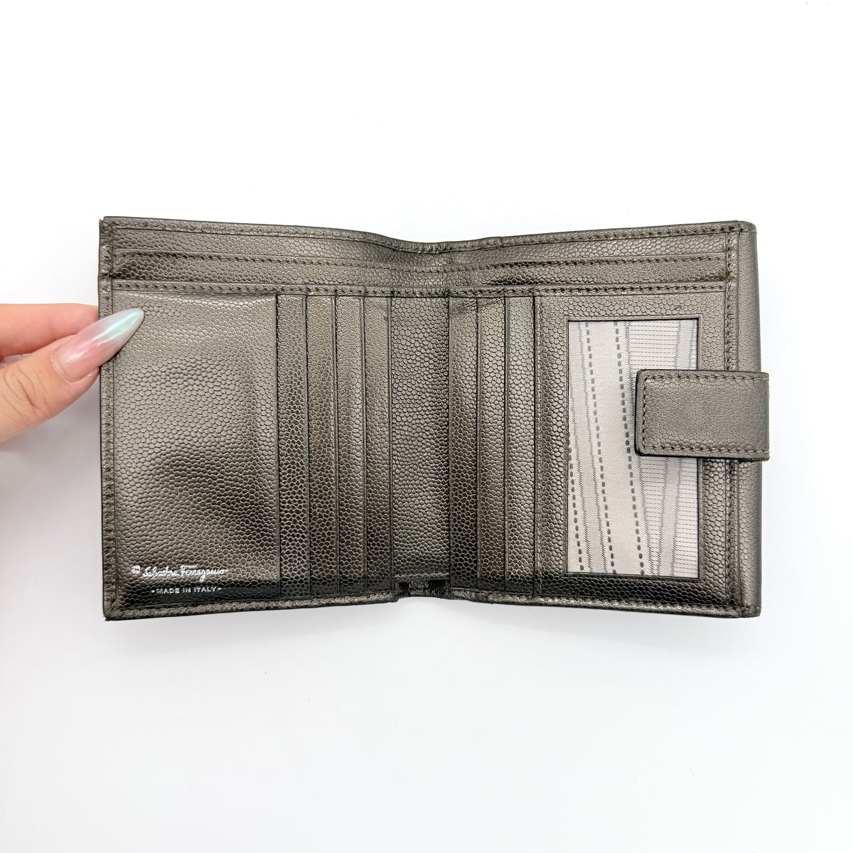 Salvatore Ferragamo Gancini Embossed Bifold Wallet in metallic grey textured leather, front view.