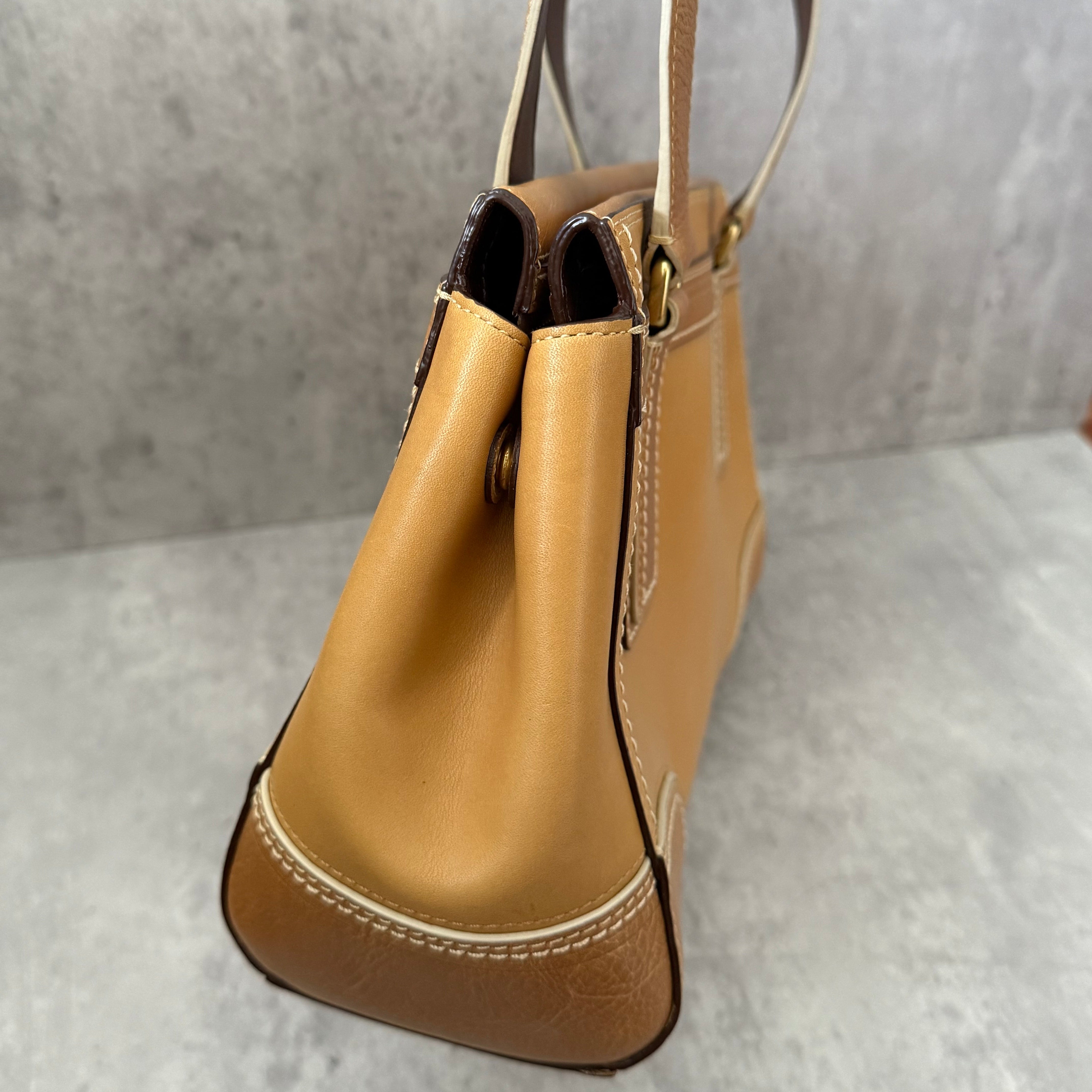 Coach Hampton Vintage Brown Beige Tan Handbag, crafted in leather with embossed signature panel, patent leather stripes, gold-tone hardware, and dual shoulder straps.