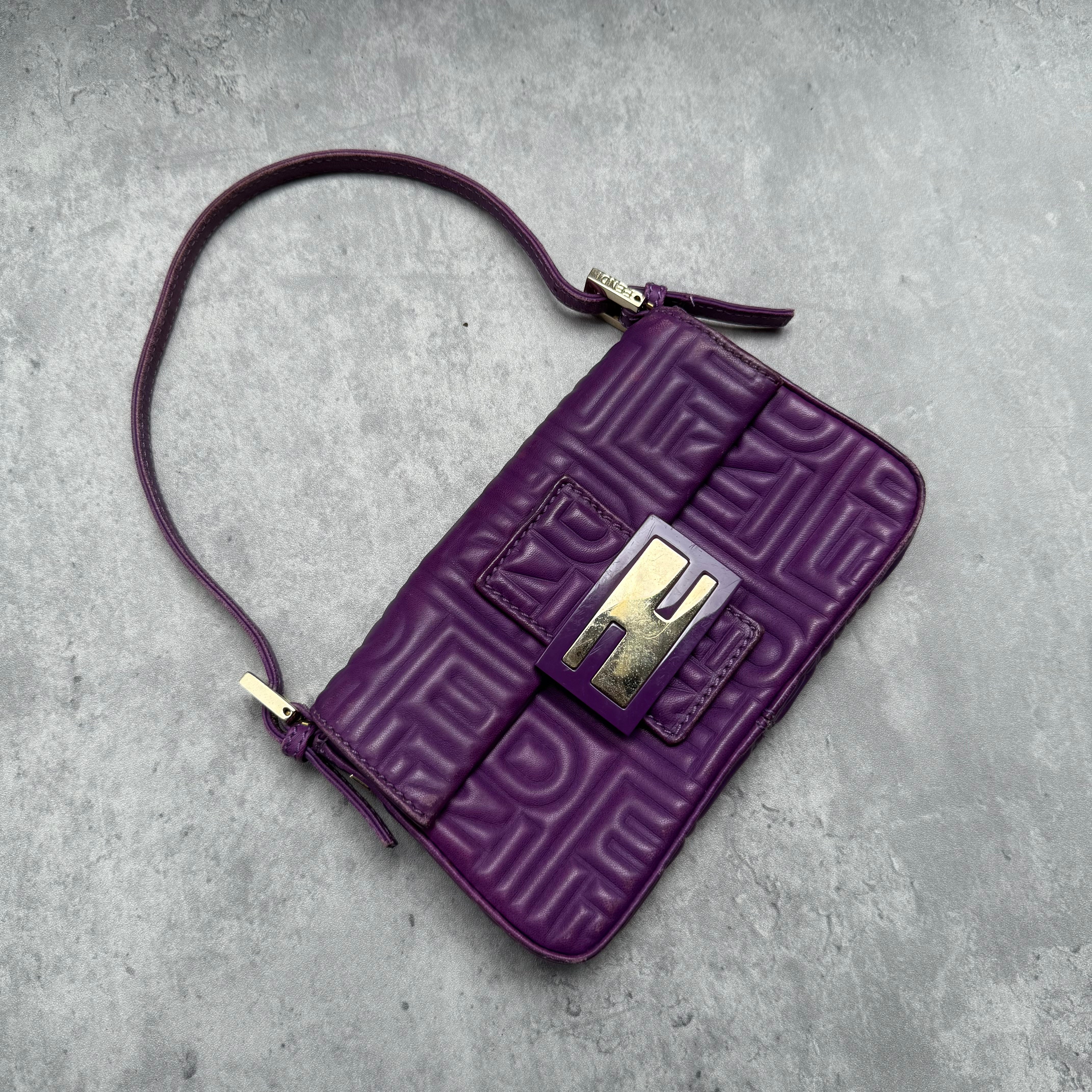 Fendi Baguette Shoulder Bag in purple embossed leather with silver FF buckle and multicolor interior lining.