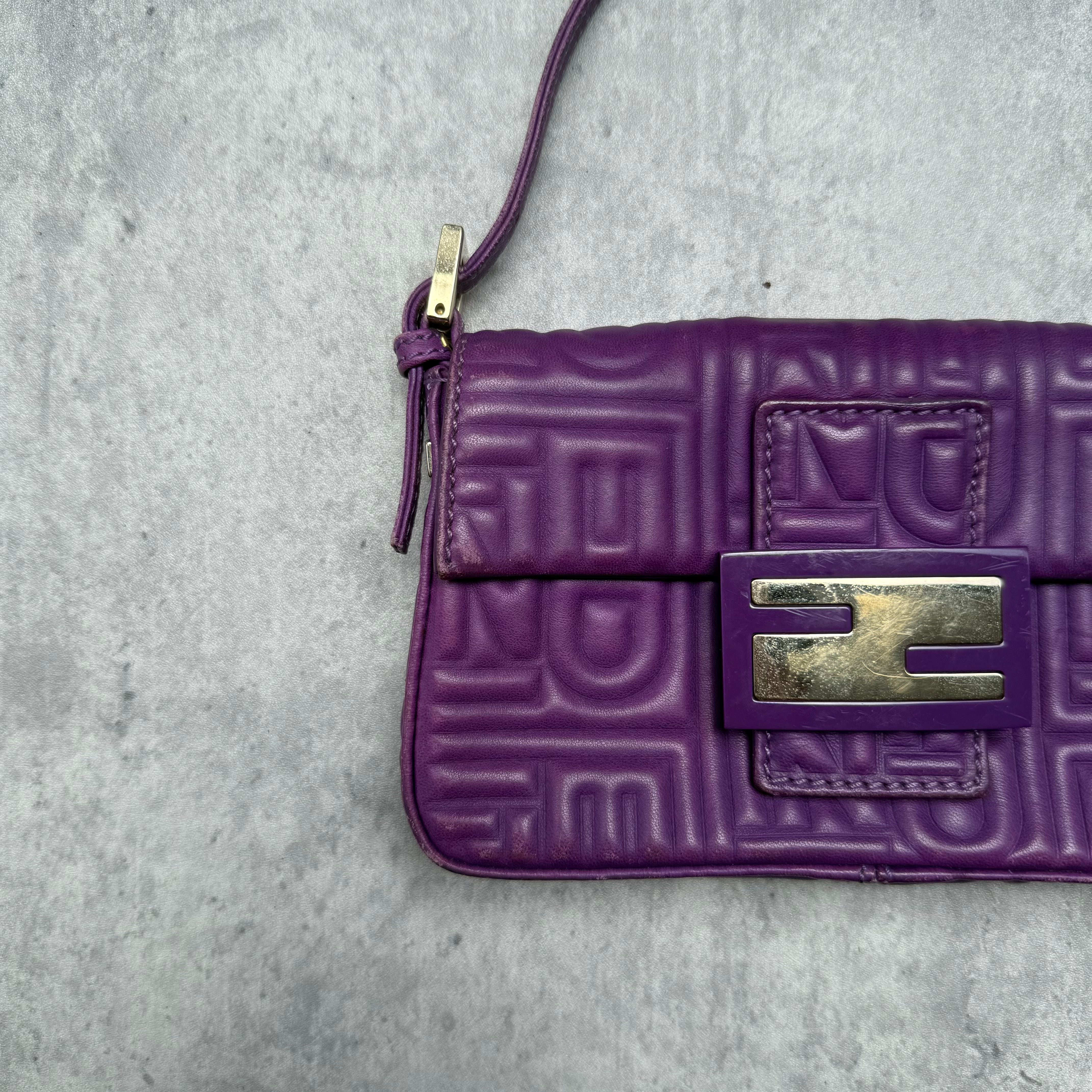 Fendi Baguette Shoulder Bag in purple embossed leather with silver FF buckle and multicolor interior lining.