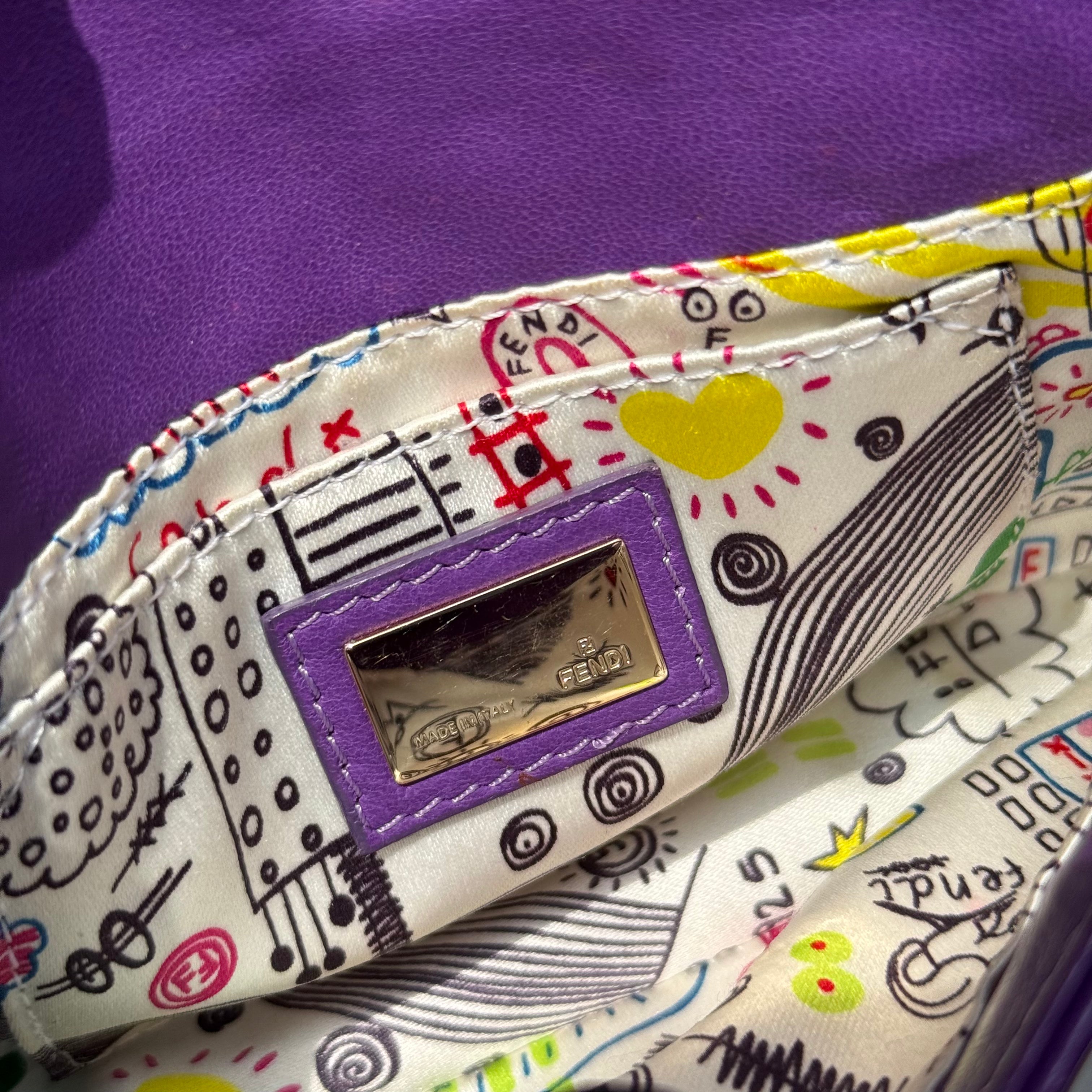 Fendi Baguette Shoulder Bag in purple embossed leather with silver FF buckle and multicolor interior lining.