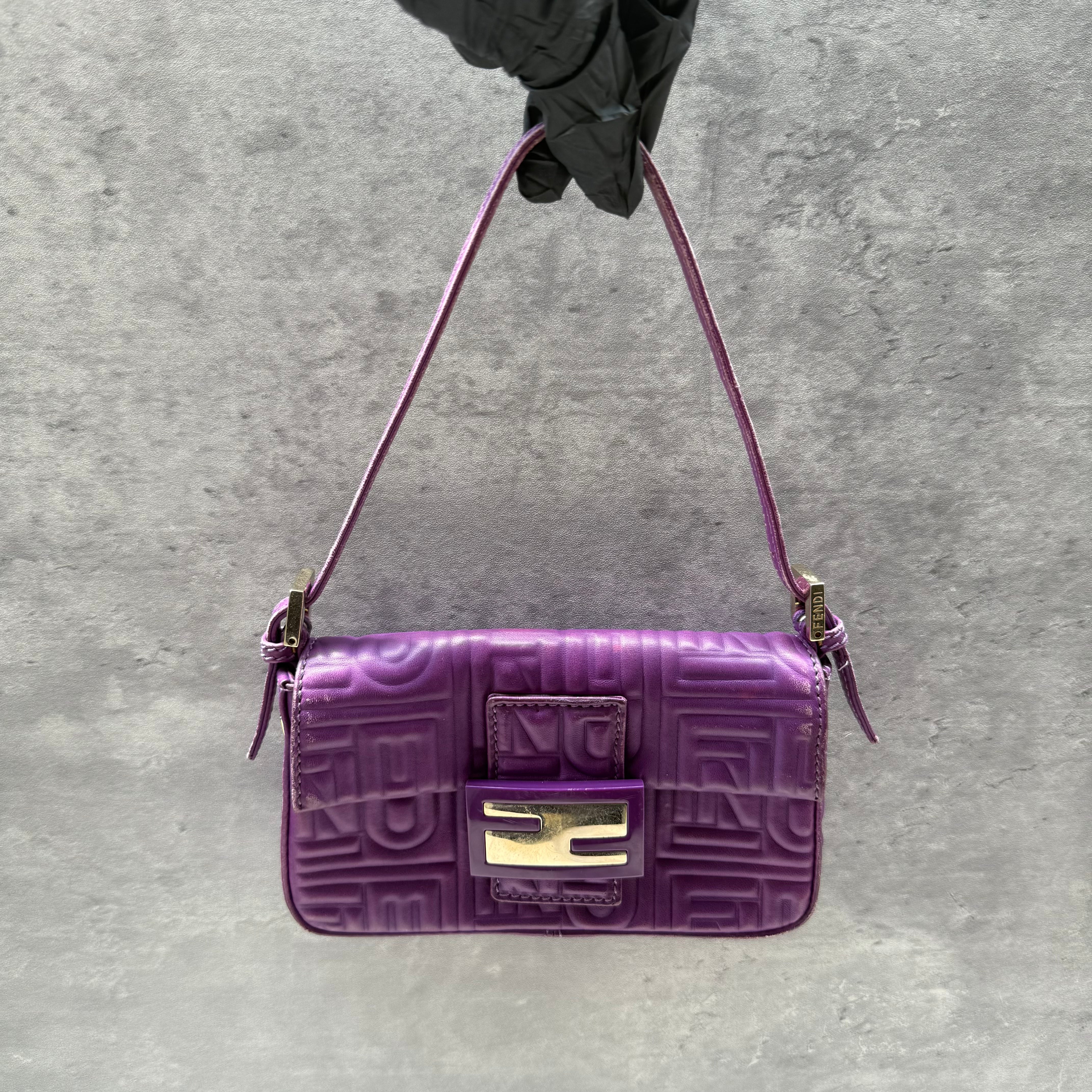 Fendi Baguette Shoulder Bag in purple embossed leather with silver FF buckle and multicolor interior lining.