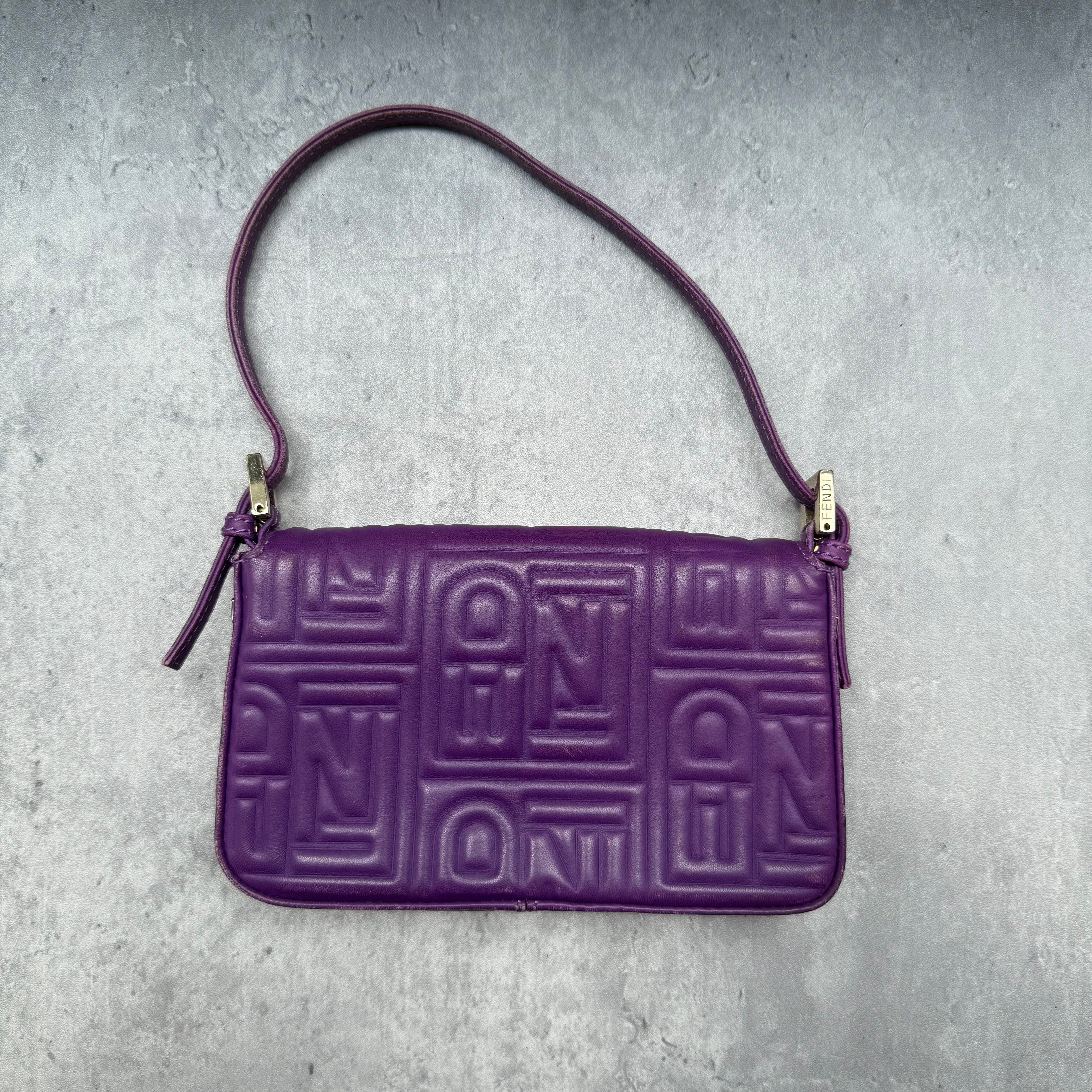 Fendi Baguette Shoulder Bag in purple embossed leather with silver FF buckle and multicolor interior lining.
