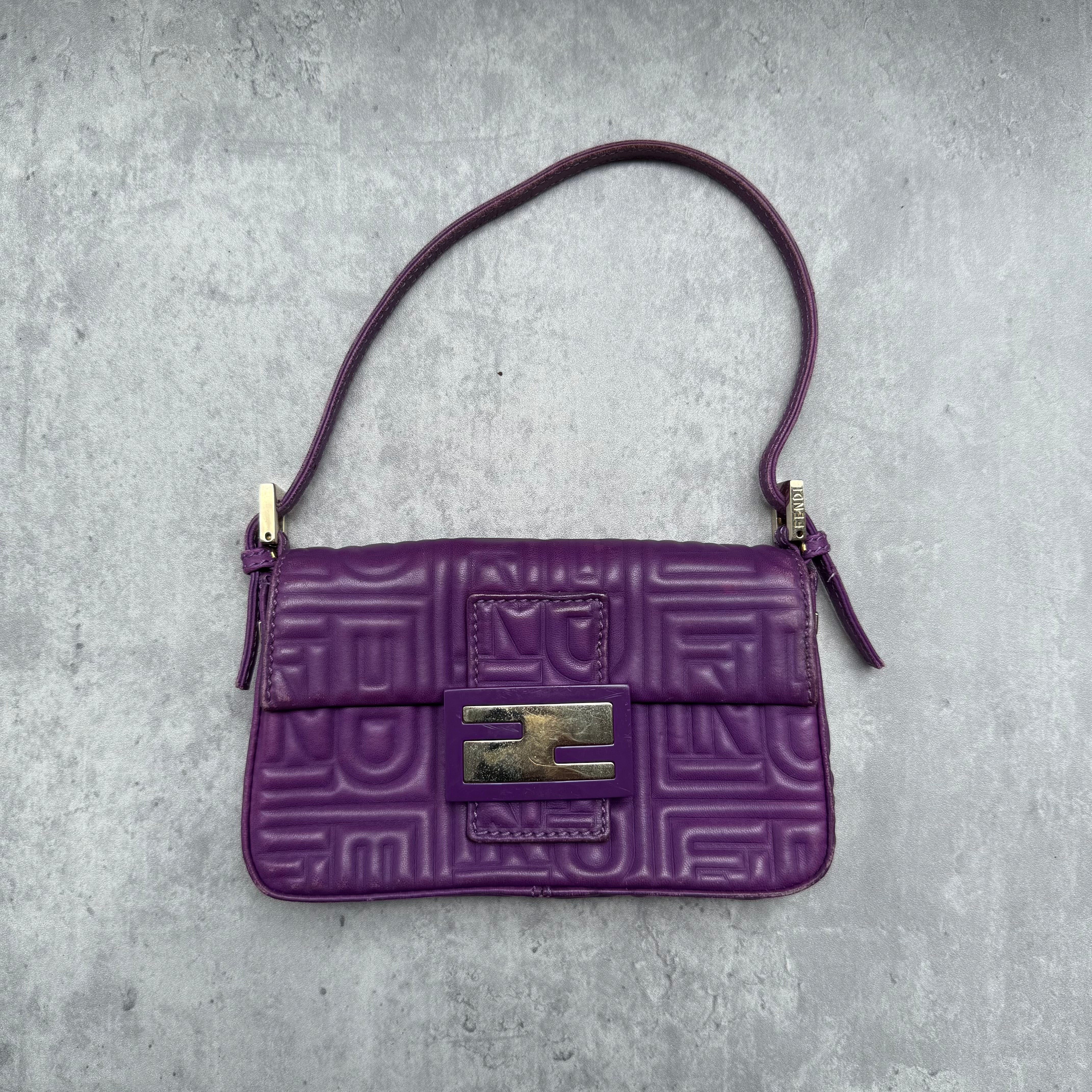 Fendi Baguette Shoulder Bag in purple embossed leather with silver FF buckle and multicolor interior lining.
