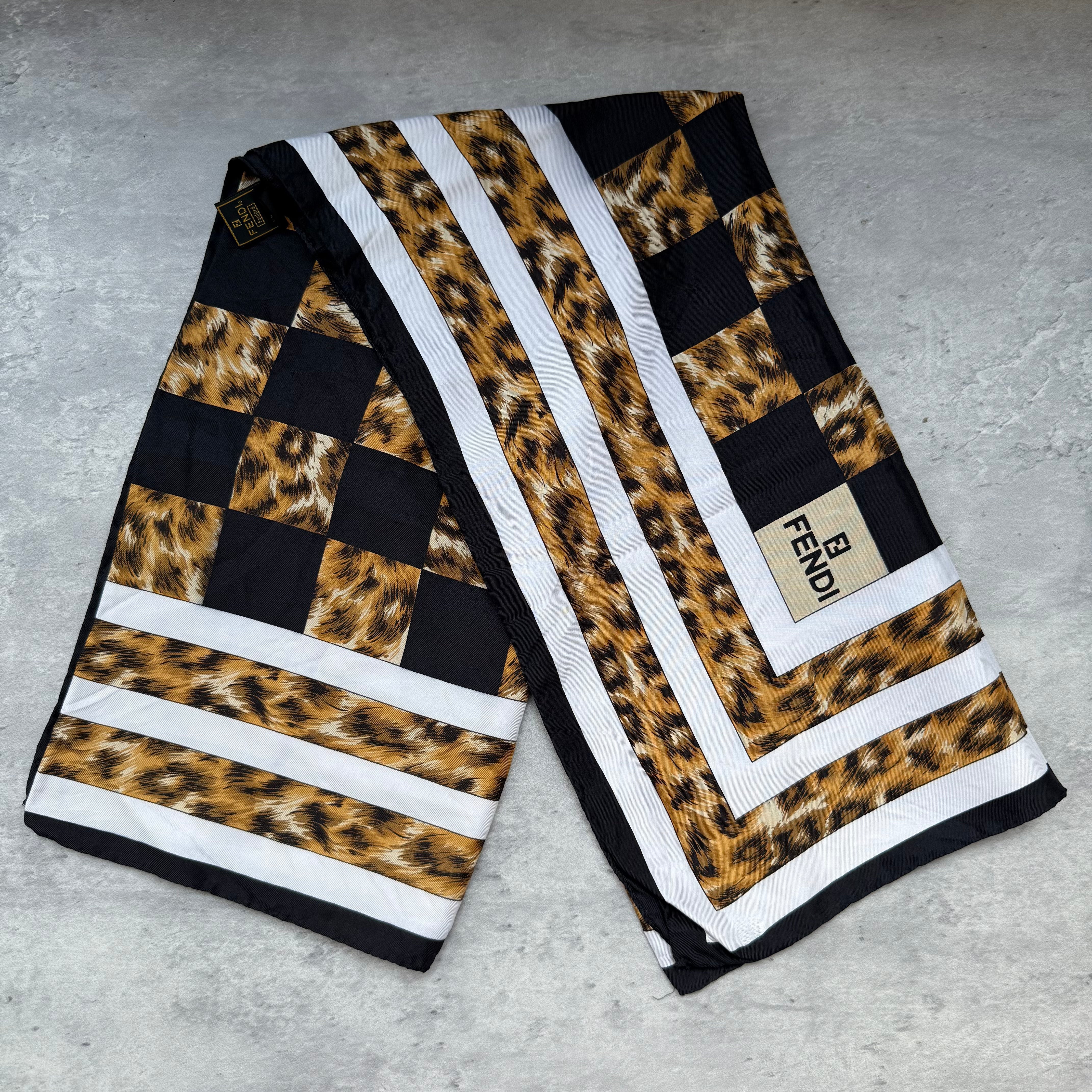 Fendi Checkered Leopard Print Silk Scarf with black, white, and brown pattern, crafted in silk.
