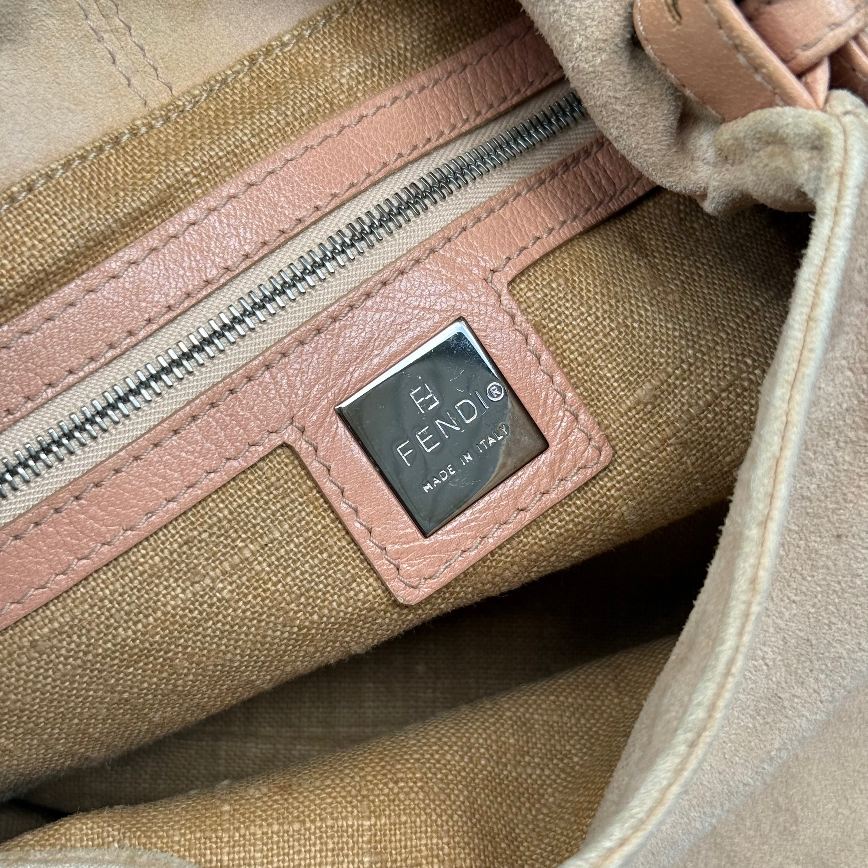 Fendi Mamma Baguette Shoulder Bag in nude suede with pink leather trim, silver FF buckle, and soft vintage structure.