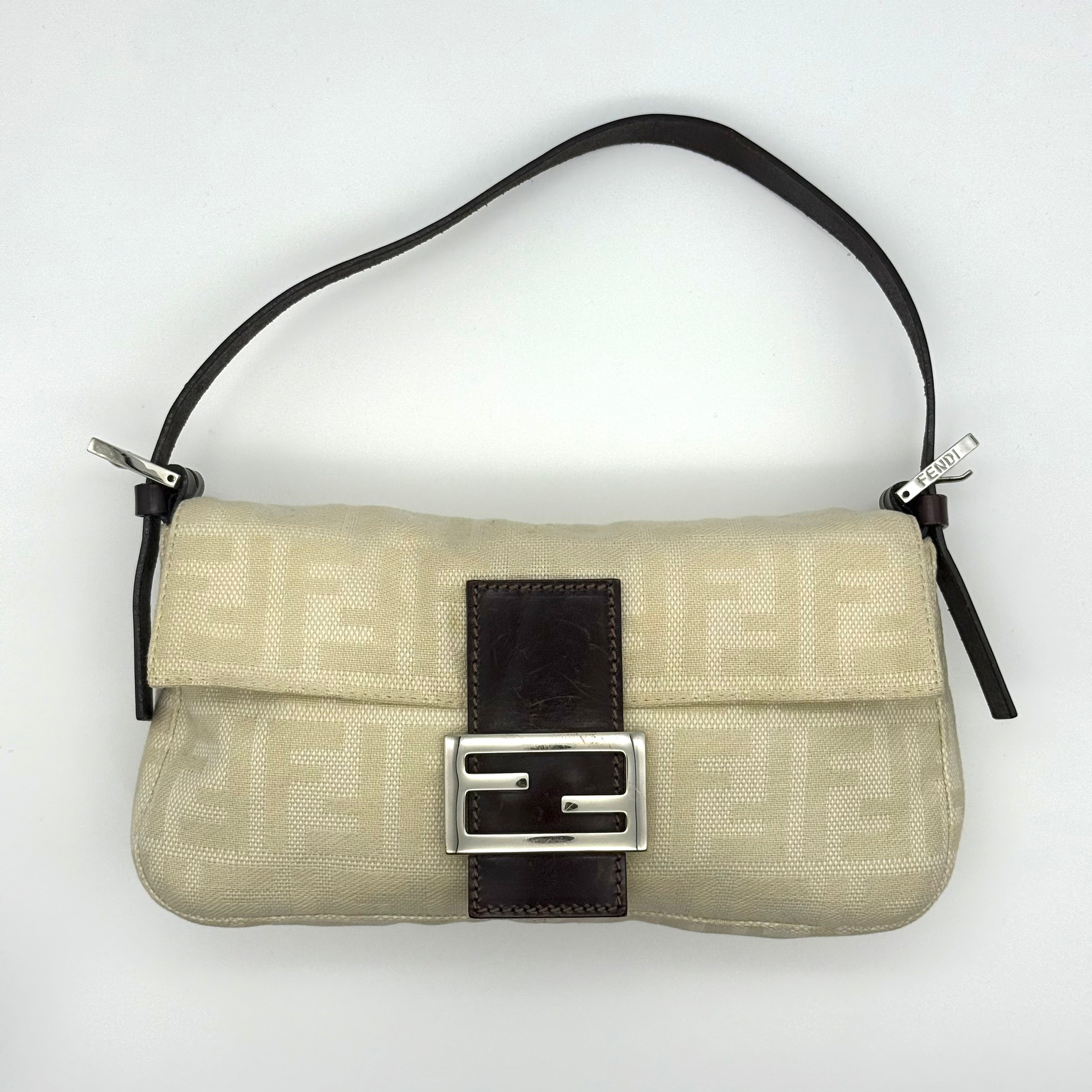Fendi Zucca Baguette bag in cream tonal FF jacquard with dark brown leather strap and buckle flap — pre-loved.