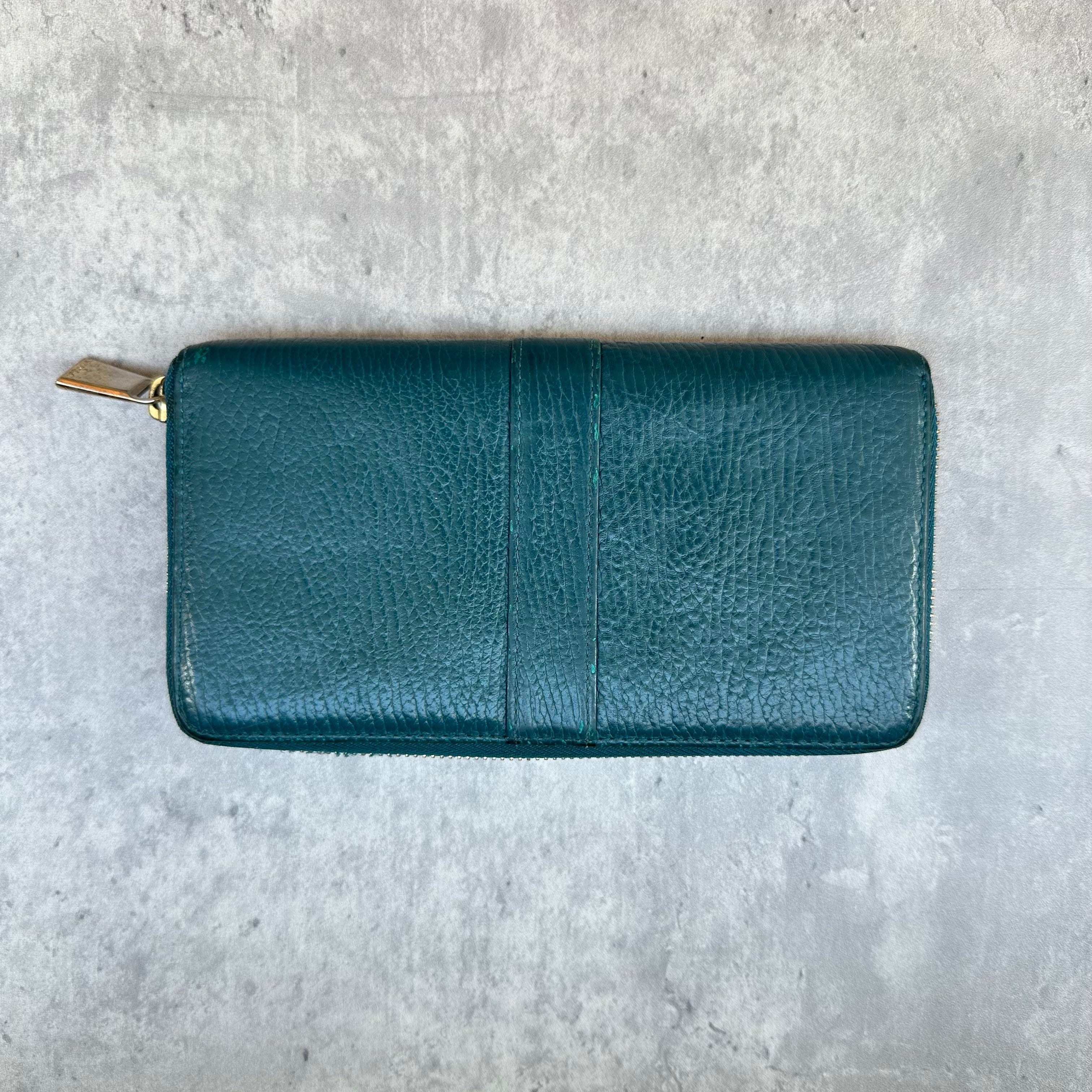 Furla Babylon Green Leather Zip Wallet with gold zipper and multiple card slots in a textured finish