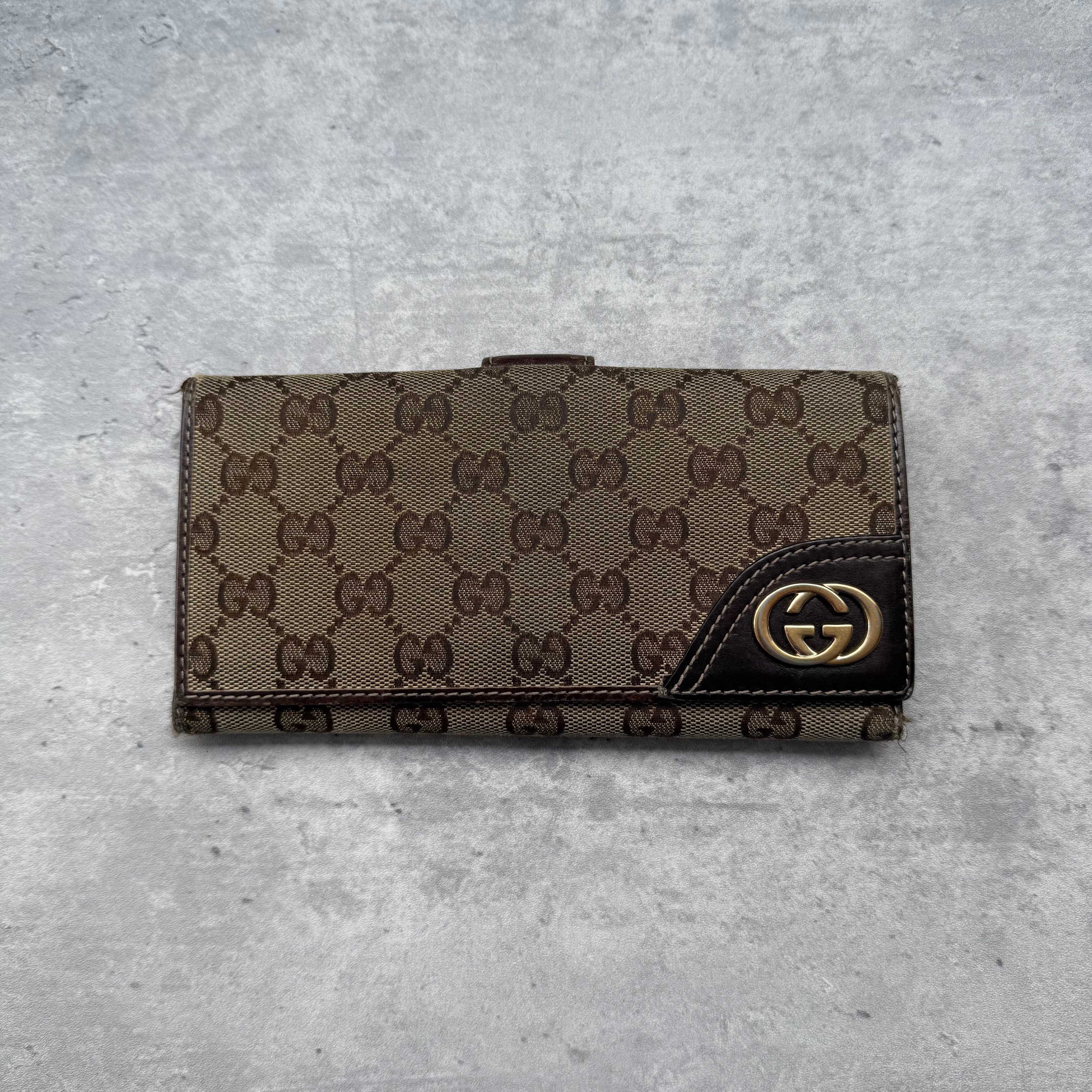 Gucci GG Monogram Britt Long Wallet Beige/Brown, crafted in GG Supreme canvas with leather trim and gold-tone GG emblem.