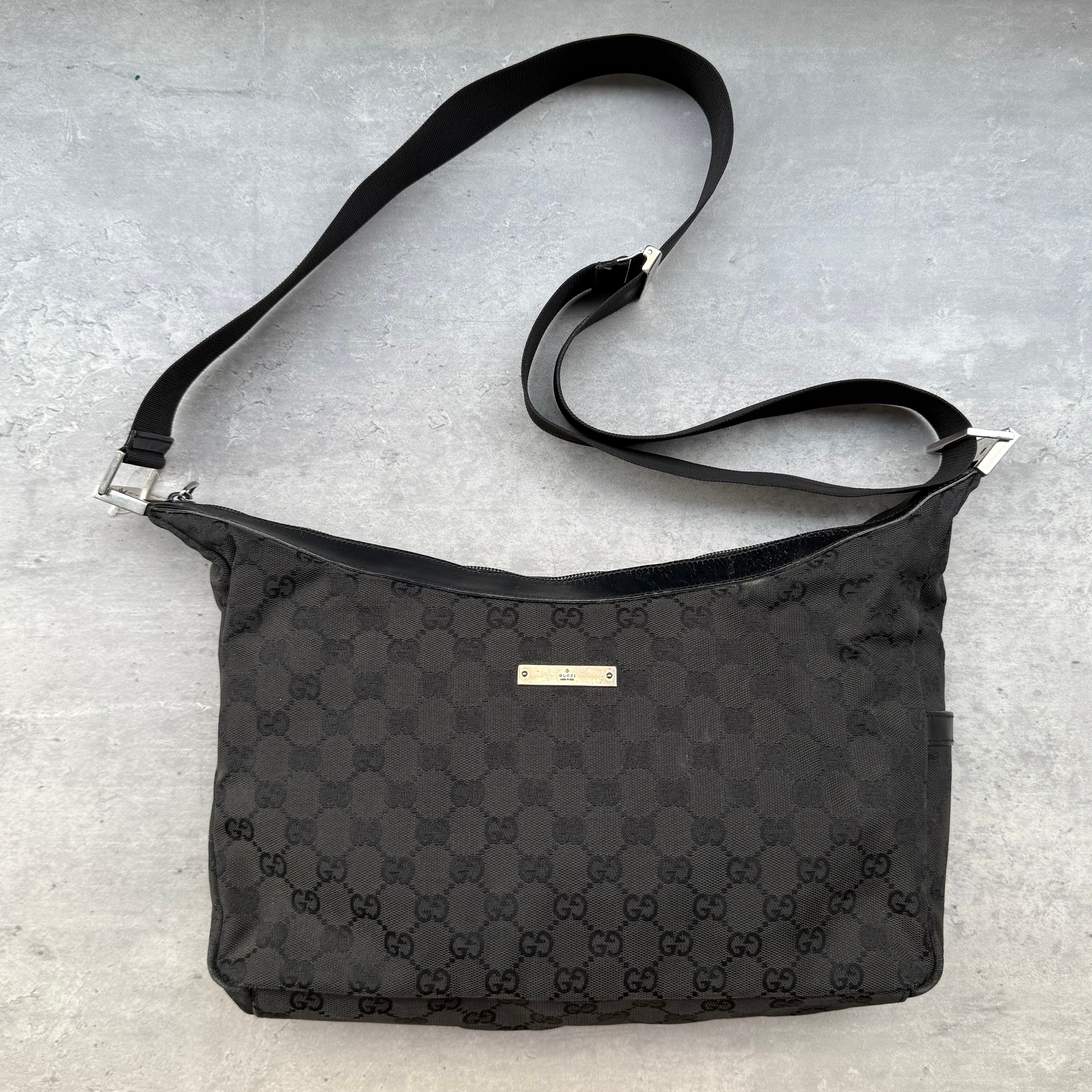 Gucci GG Monogram Crossbody Bag in black canvas with silver-tone logo plaque and adjustable strap