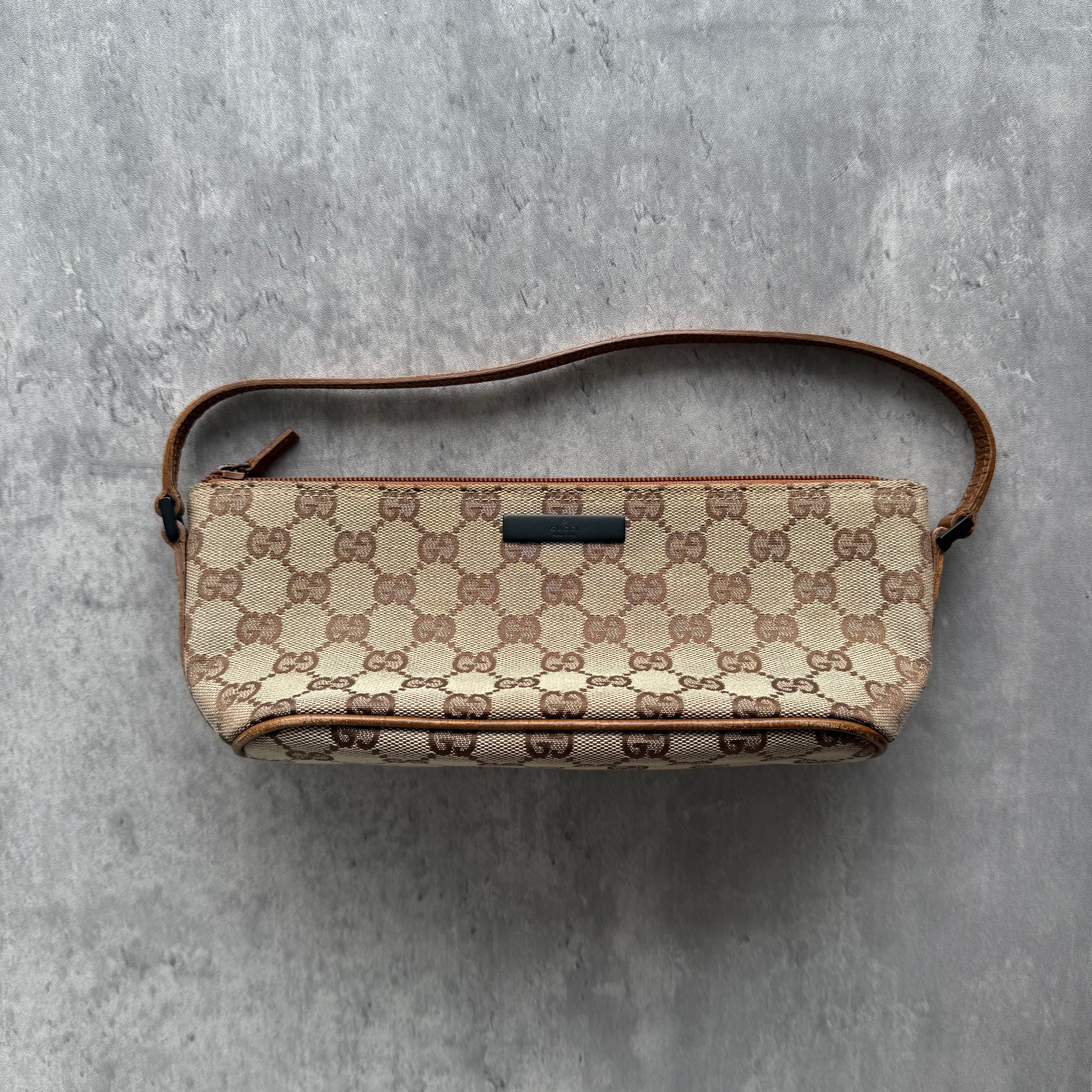 Gucci GG Monogram Pochette Boat Shoulder Bag in beige canvas with brown leather trim and minimalist silver logo plaque