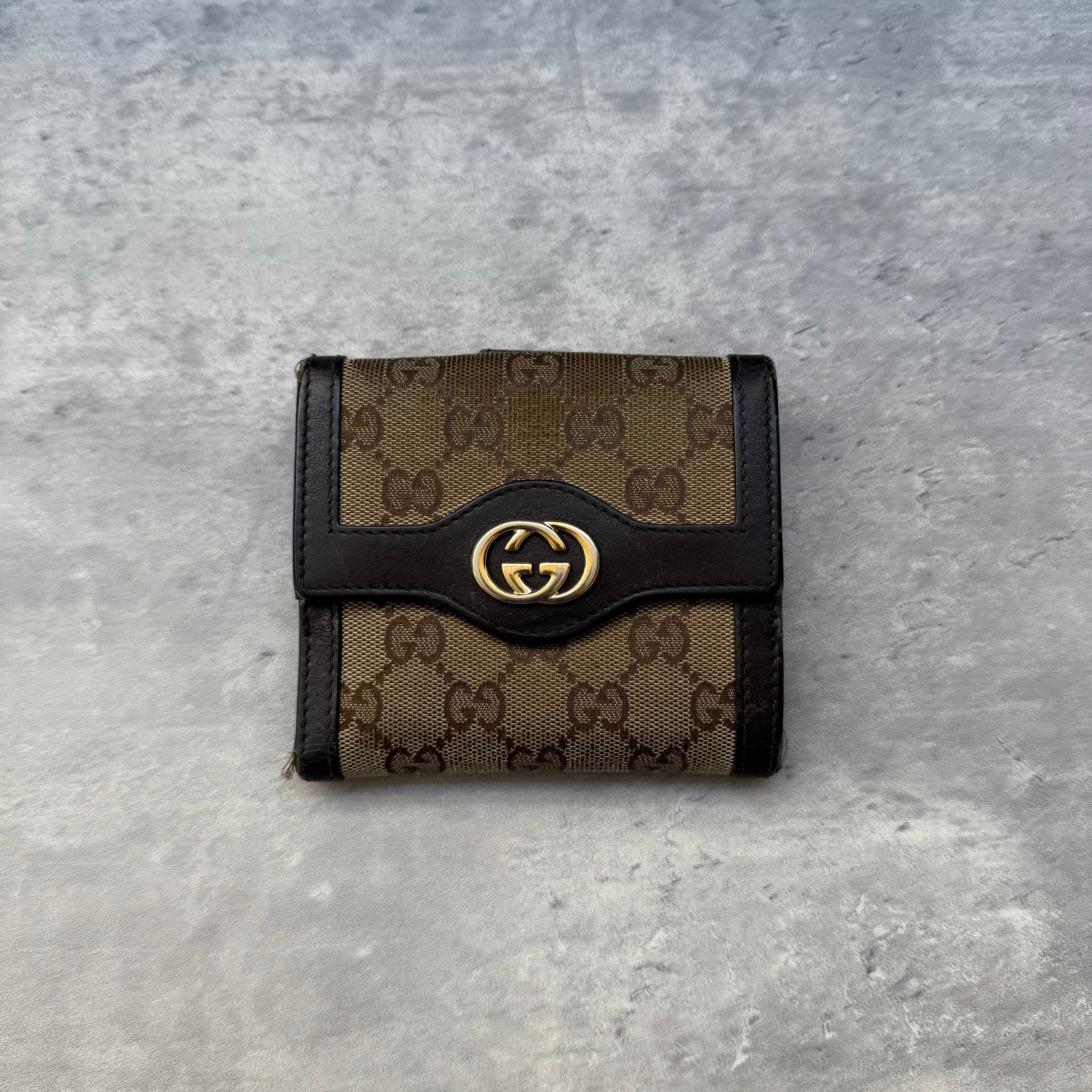 Gucci GG Monogram Small Wallet in beige canvas with dark brown leather trim and gold-tone GG logo, featuring card slots and coin pocket.