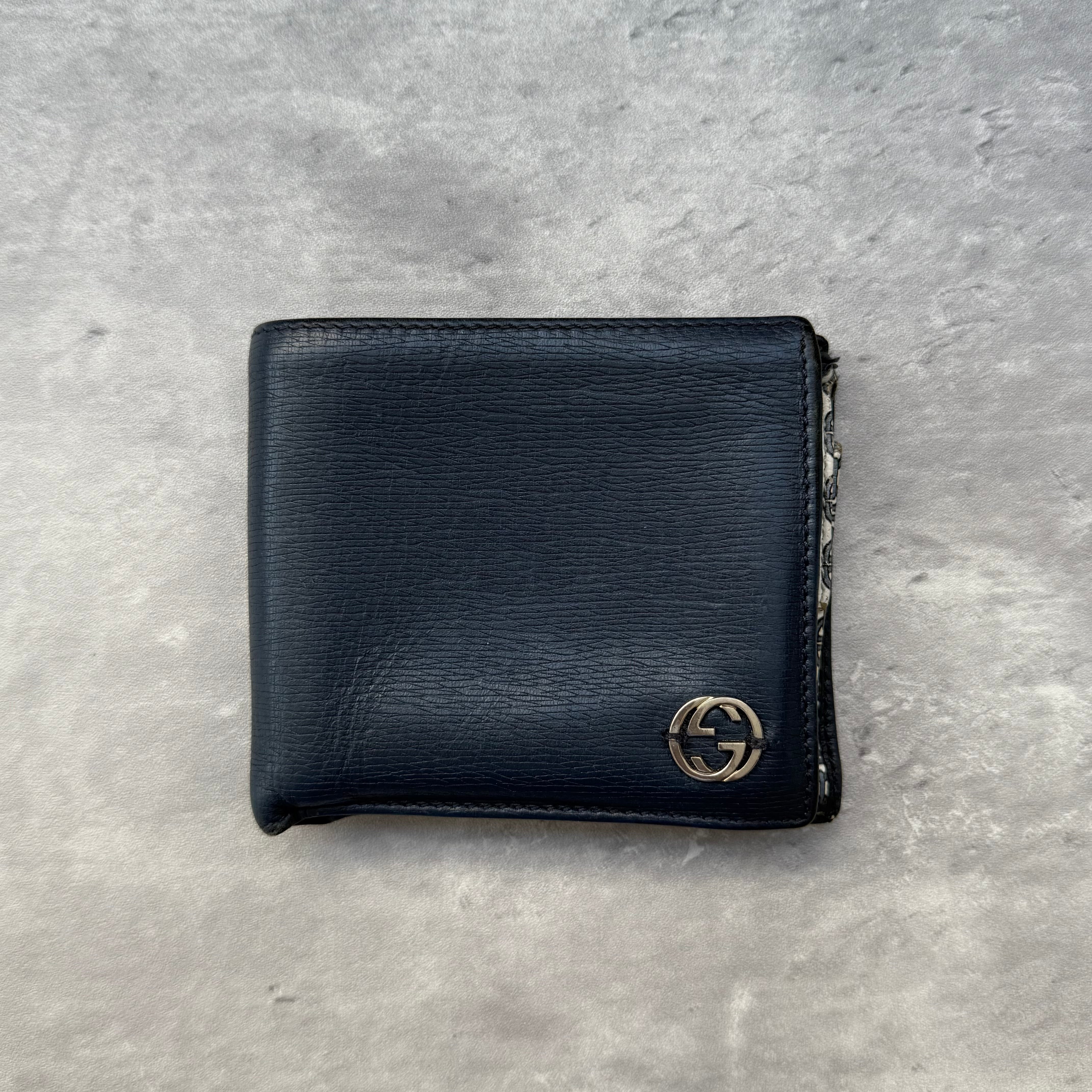 Gucci Monogram Bifold Wallet Dark Blue/White, crafted in smooth dark blue leather with silver-tone G logo and monogram chain-print interior.