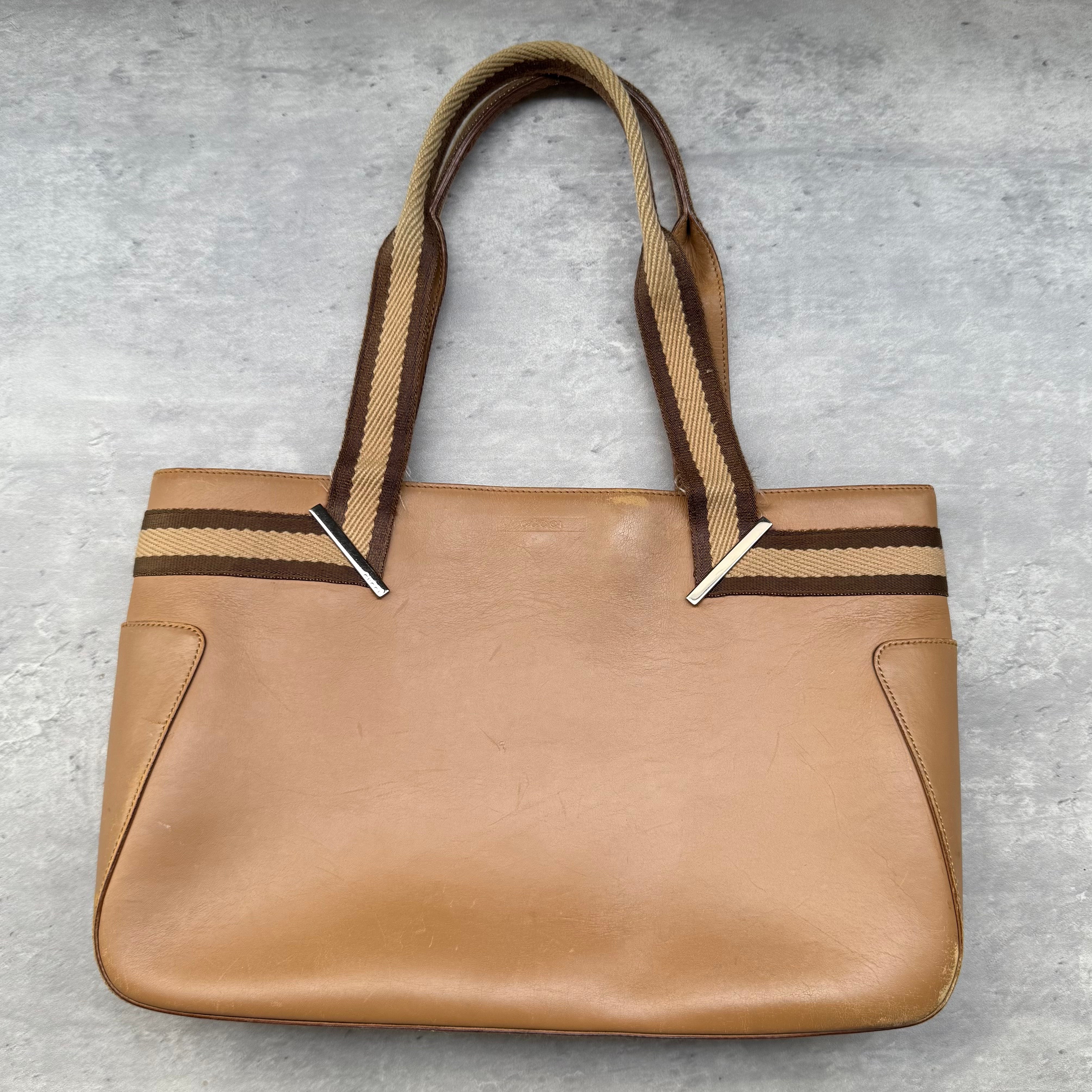 Gucci Stripe Web Leather Handbag in brown leather with green and red web stripe handles and spacious interior.
