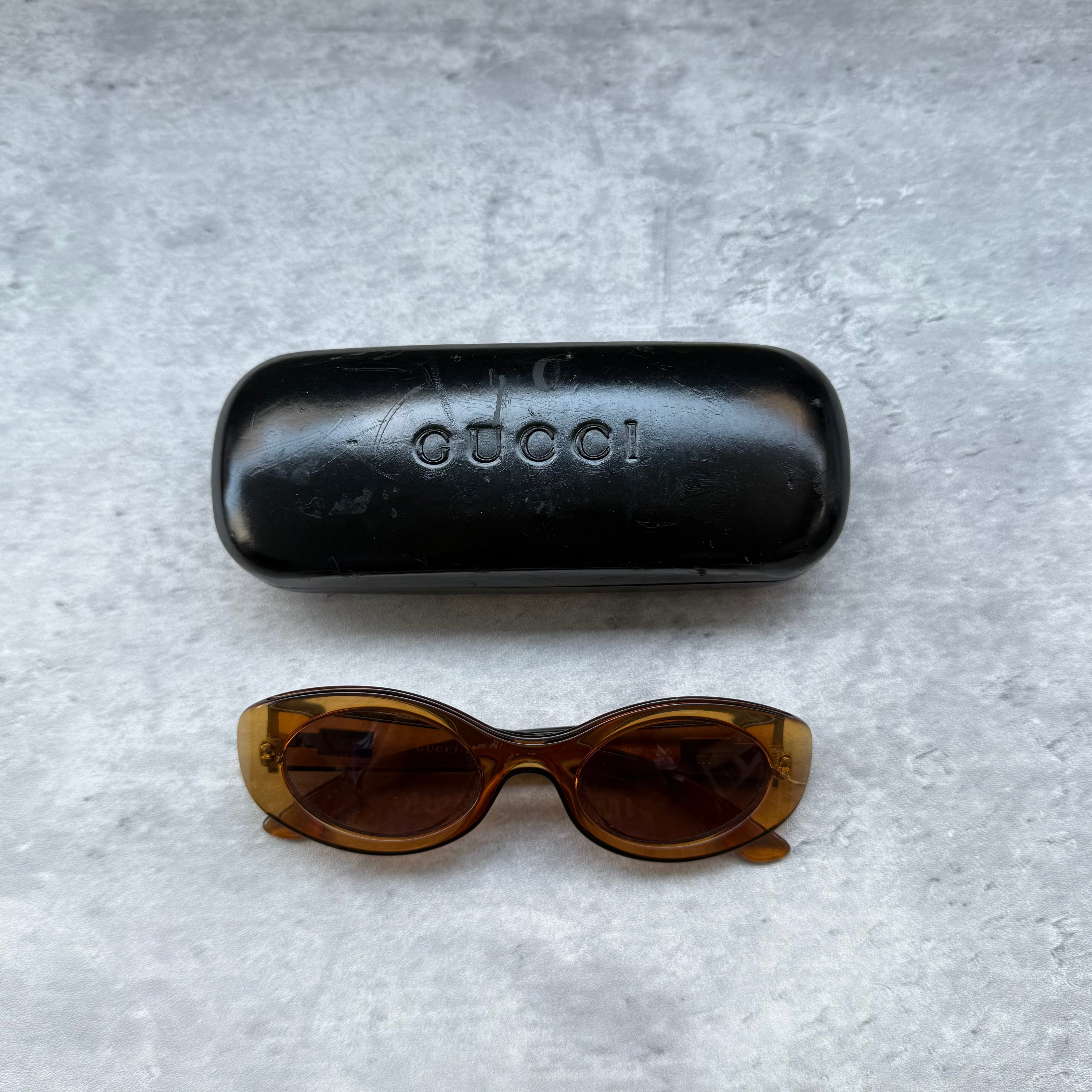 Gucci Vintage Sunglasses Light Brown with oval acetate frame and tinted lenses, featuring Gucci logo at temples.