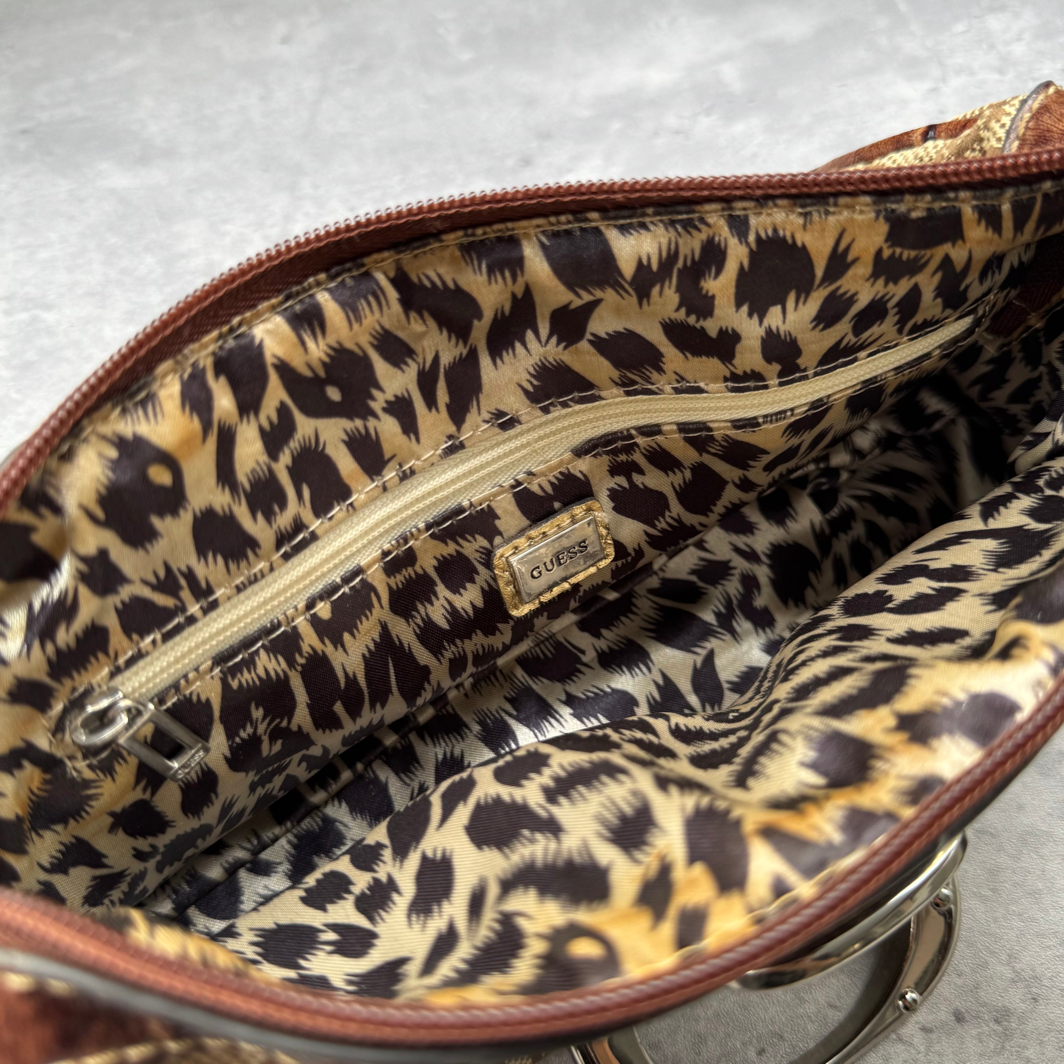 Guess Vintage 00s Monogram Y2K Bag in beige canvas with brown faux croc leather trim, silver-tone hardware, and leopard print lining.