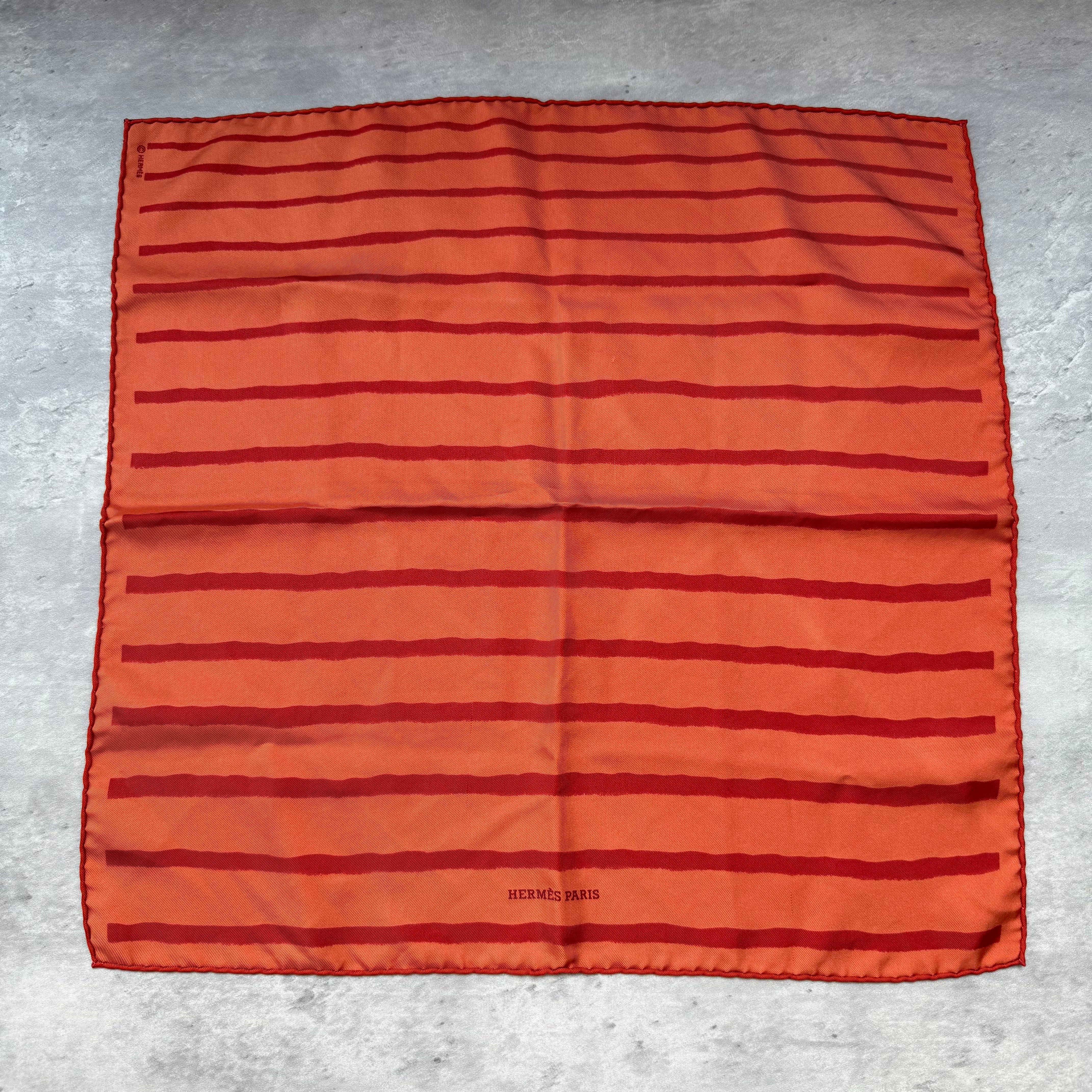 Hermès Paris Stripes Silk Scarf in orange with red stripe detailing, crafted from silk.