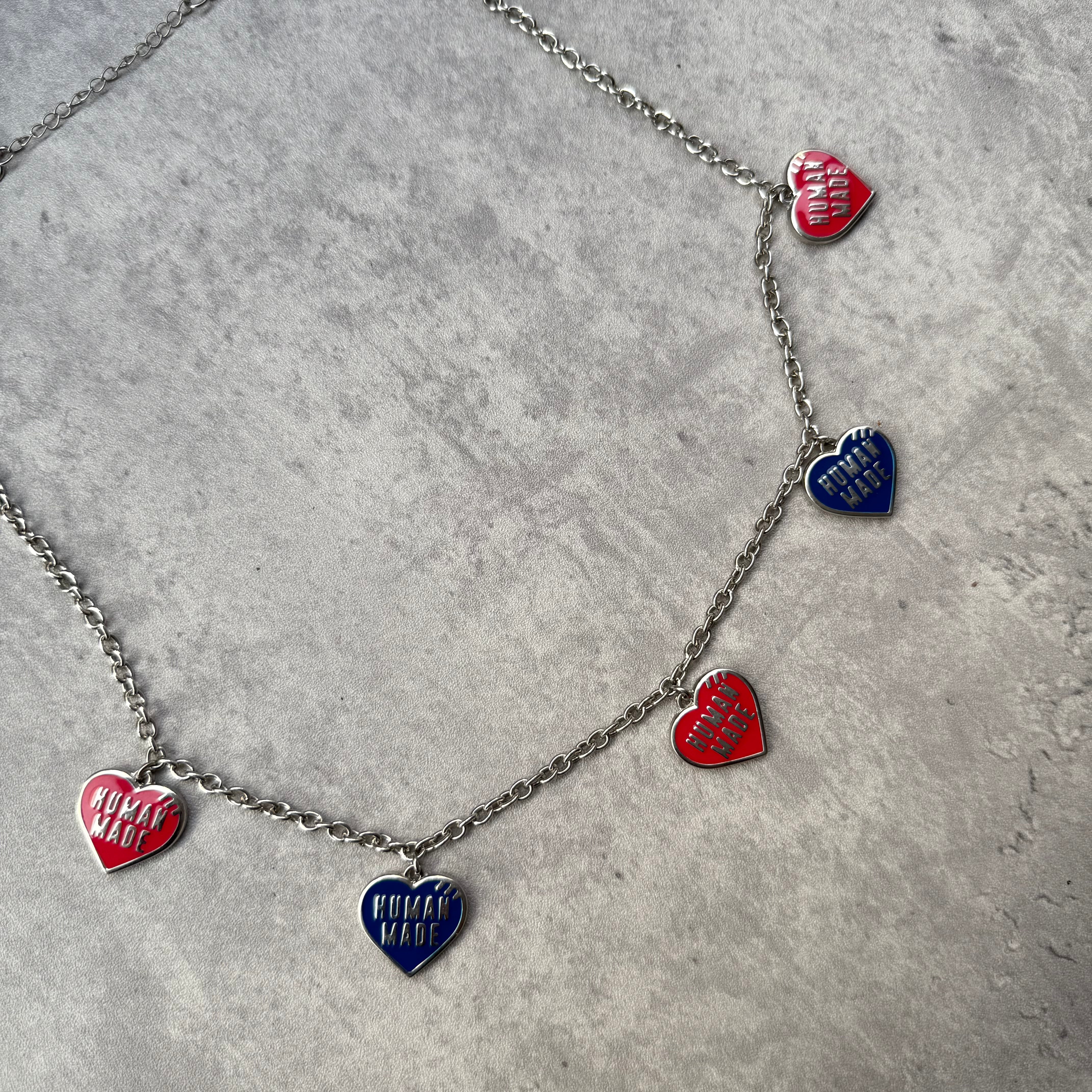 Human Made 5 Hearts Necklace with silver-tone chain, featuring alternating red and blue enamel heart charms