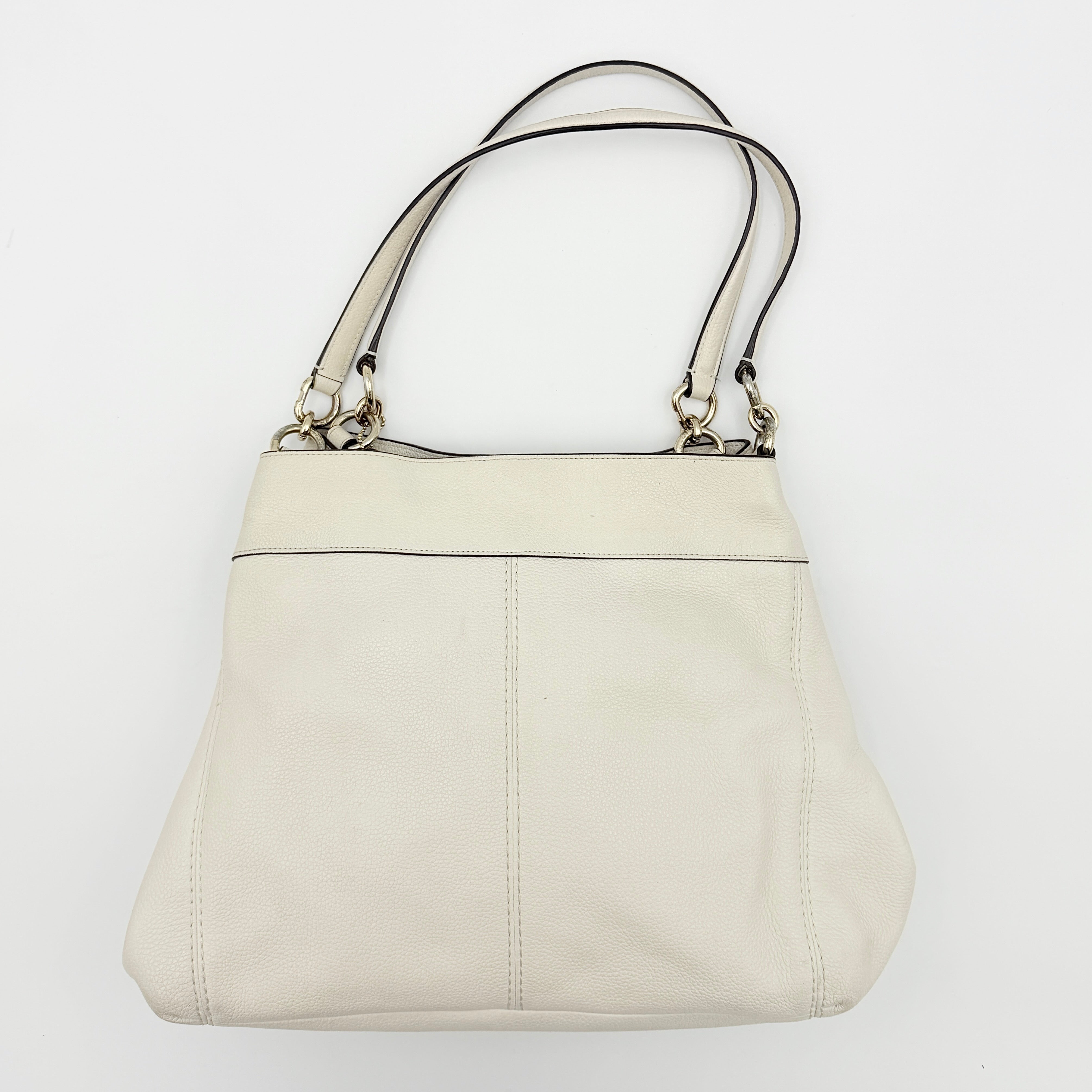 Coach Lexy Stardust Studded Chalk Hobo in ivory pebbled leather, adorned with mixed metal studs and dual handles.