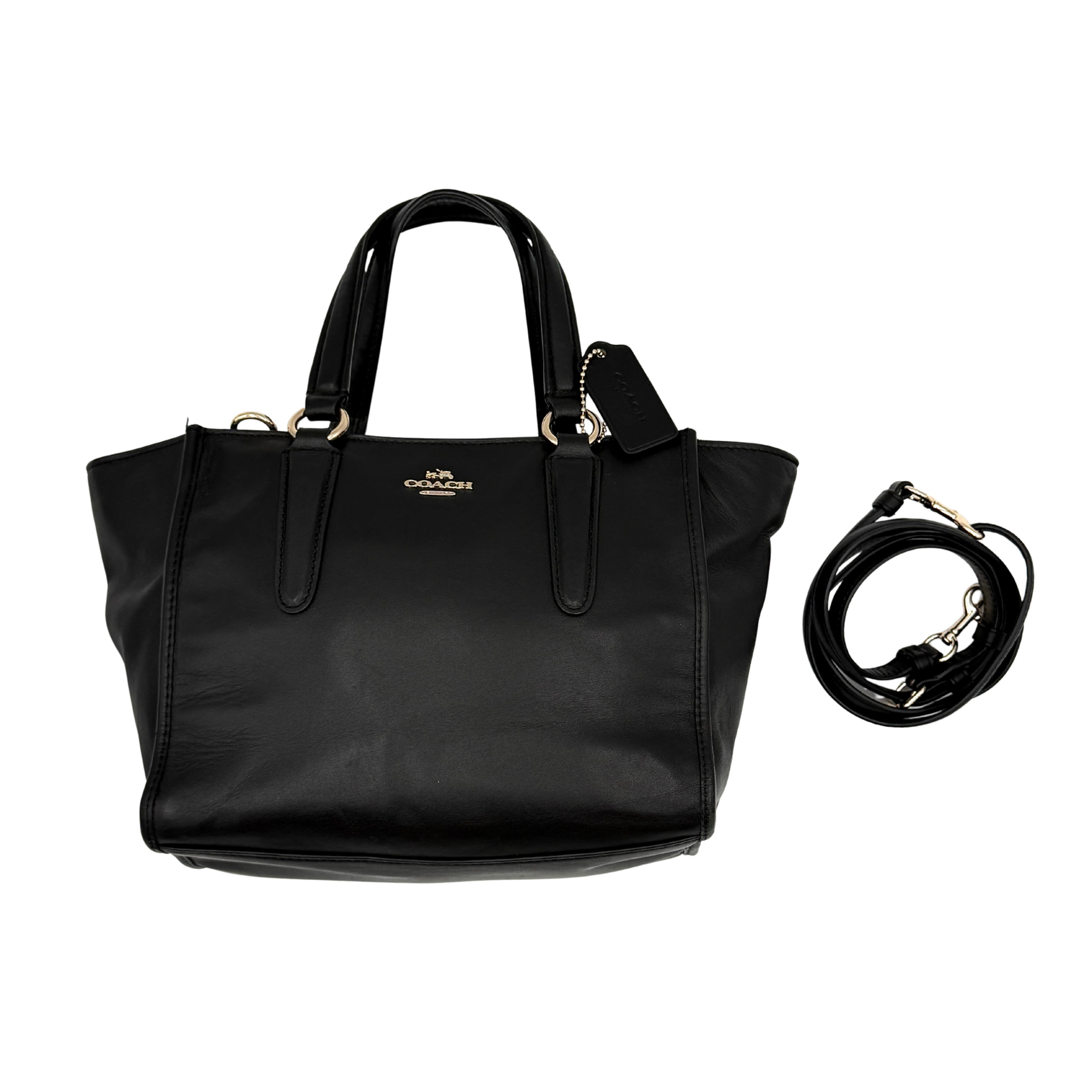 The Coach 2Way Mini Crosby Carryall Handbag in smooth black leather with gold-tone hardware, top handles, and detachable strap displayed alongside.