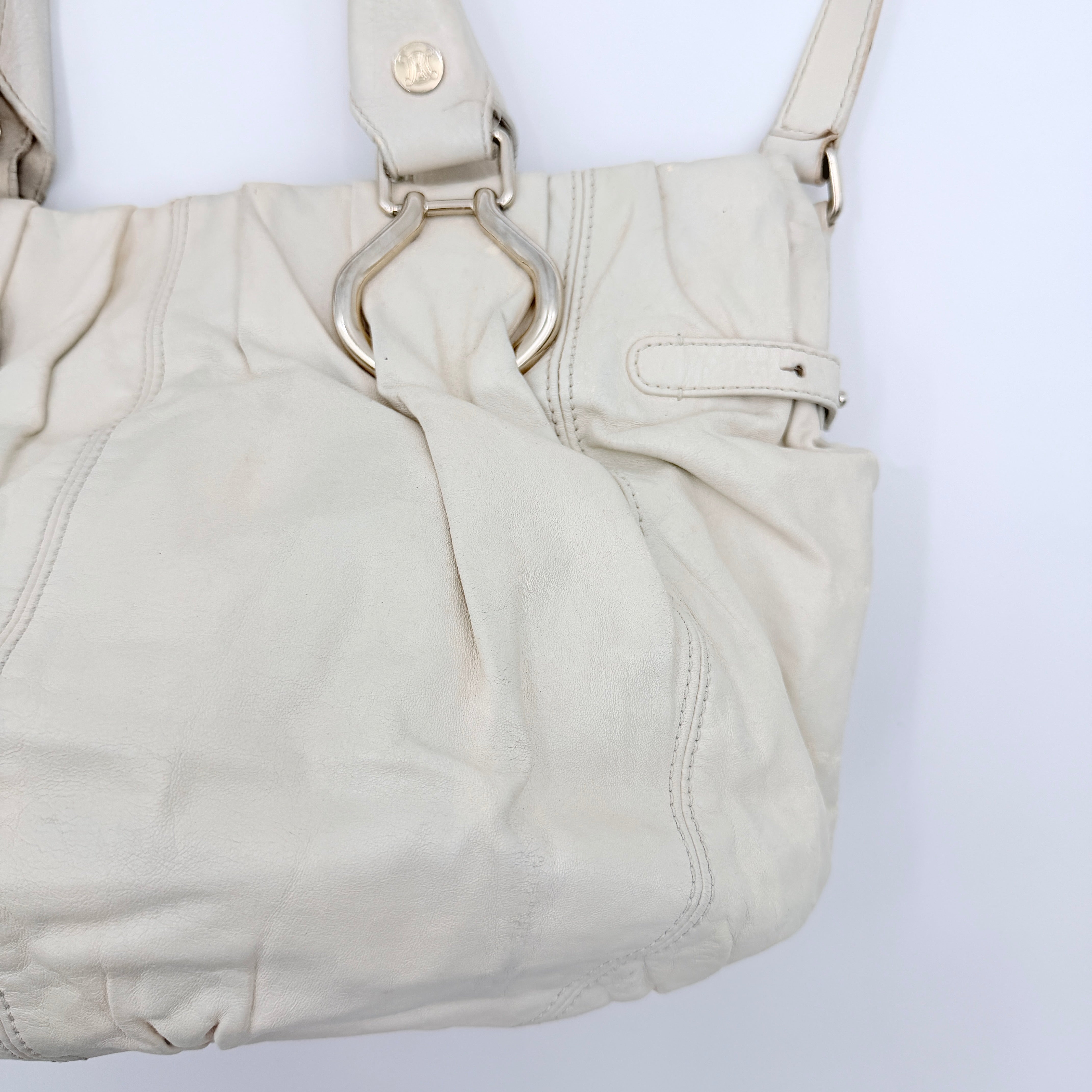 Celine 2Way Leather Shoulder Bag in white leather with architectural silver hardware, top handles, and an adjustable shoulder strap.