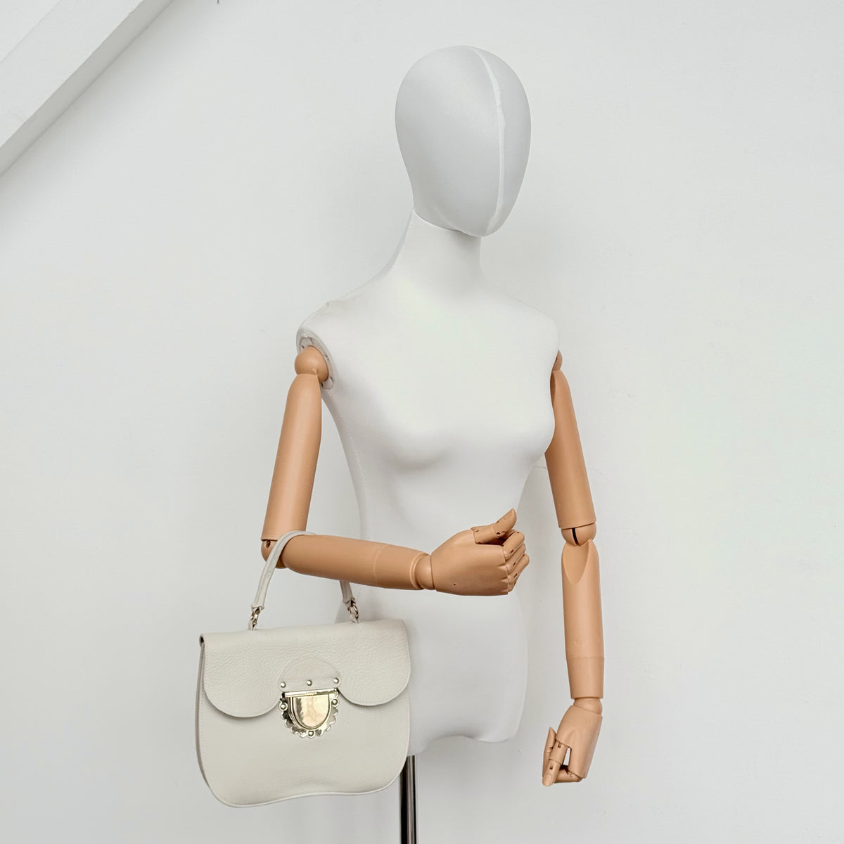 Furla 2Way Ducale Mini Handbag in creamy white leather with gold hardware, top handle, and detachable strap displayed flat with authenticity card.