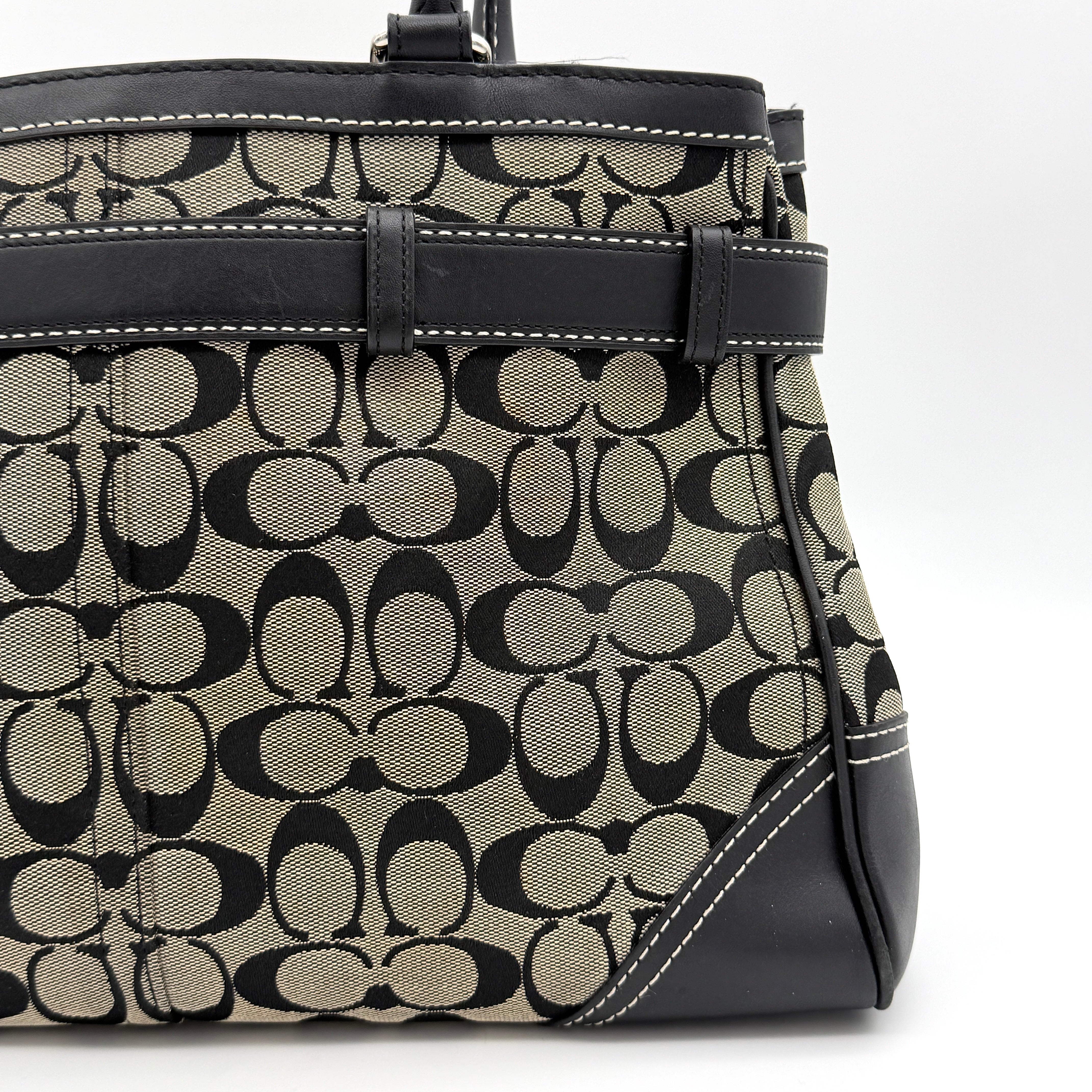 Coach Signature Hampton Clip Shoulder Bag in grey and black canvas with leather trim and silver-tone hardware, displayed with double handles.