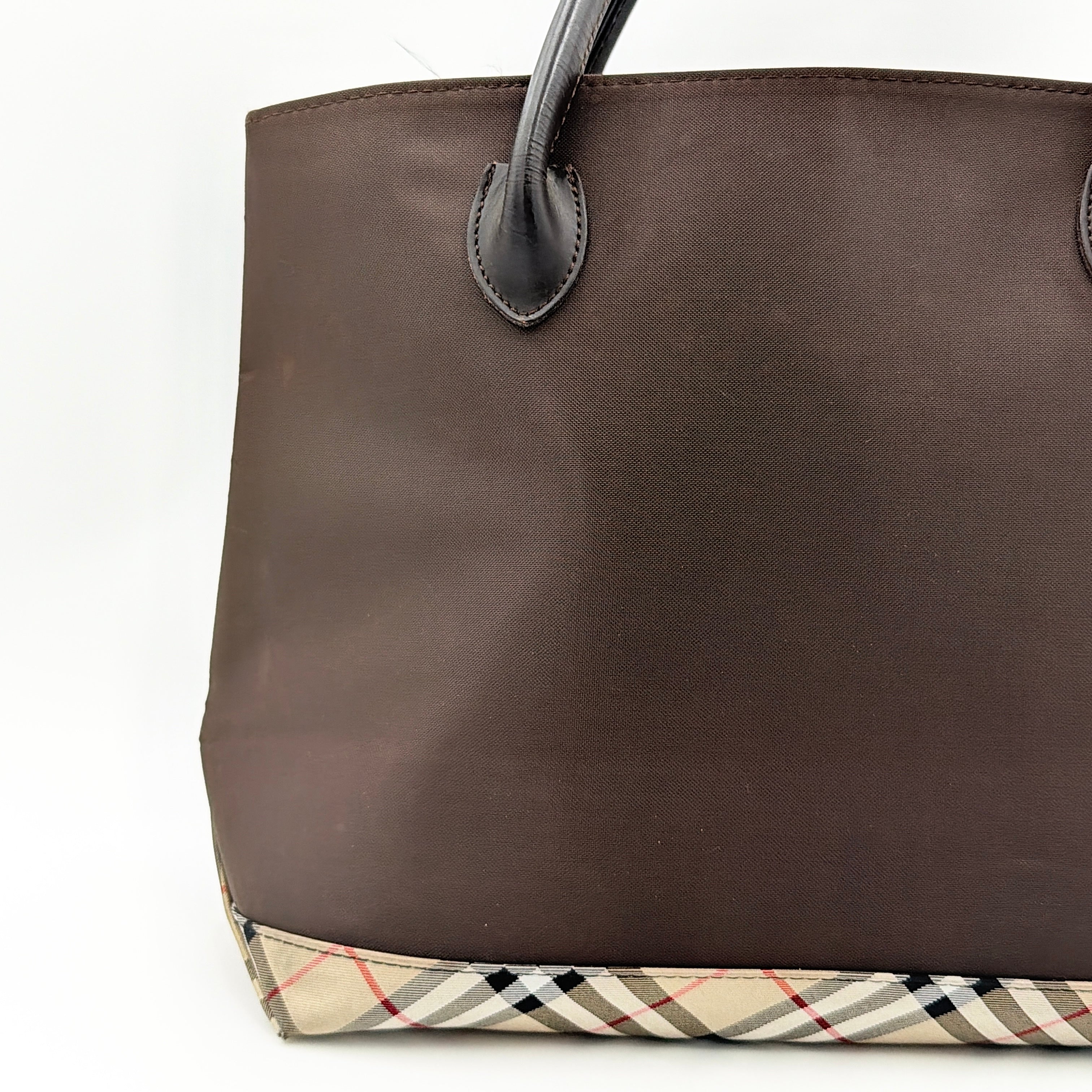 Burberry Blue Label nylon tote bag in brown with iconic check-detail base and structured double handles.