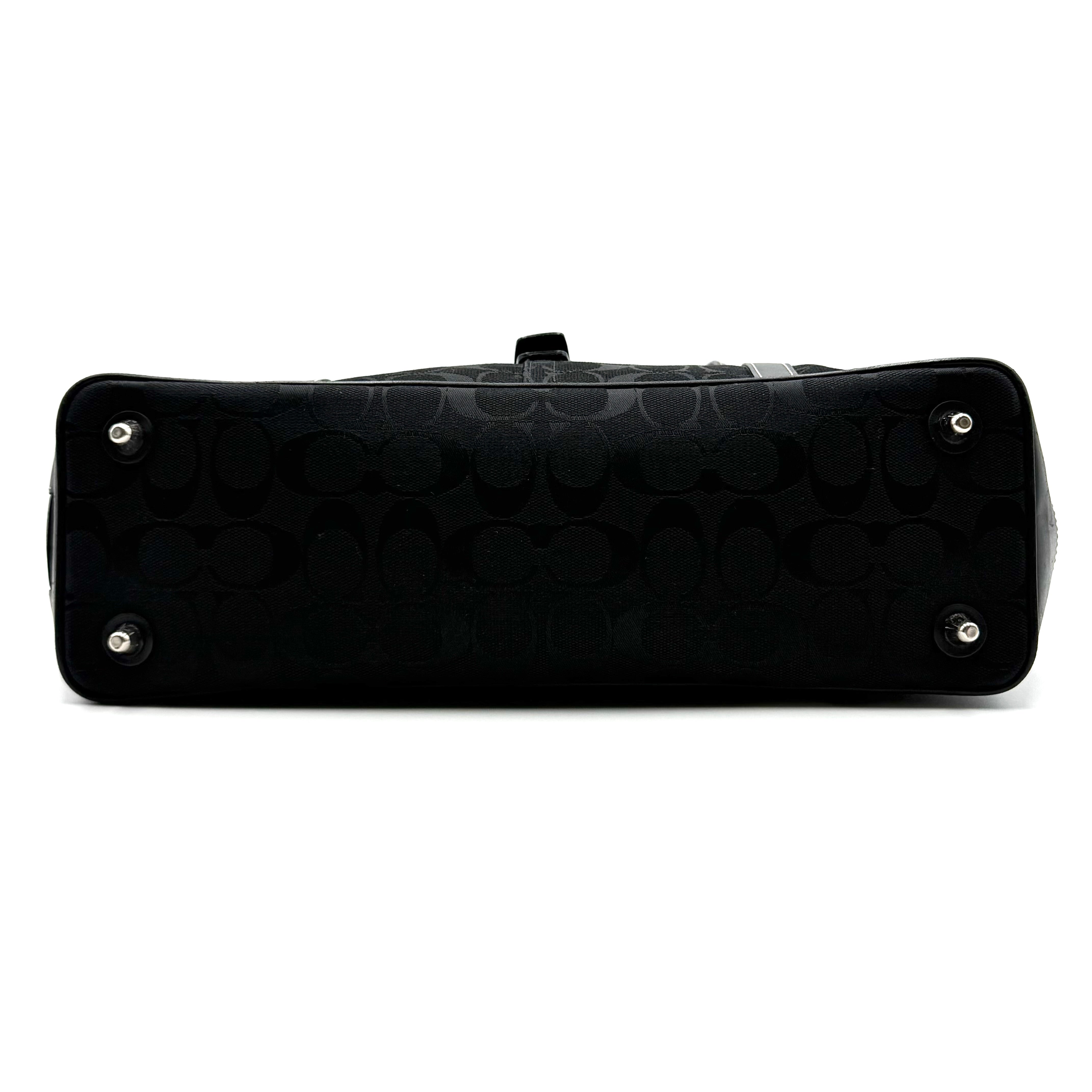 Coach black Soho Hampton Buckle Flap Shoulder Bag with jacquard pattern, leather trim, and silver buckle detail.