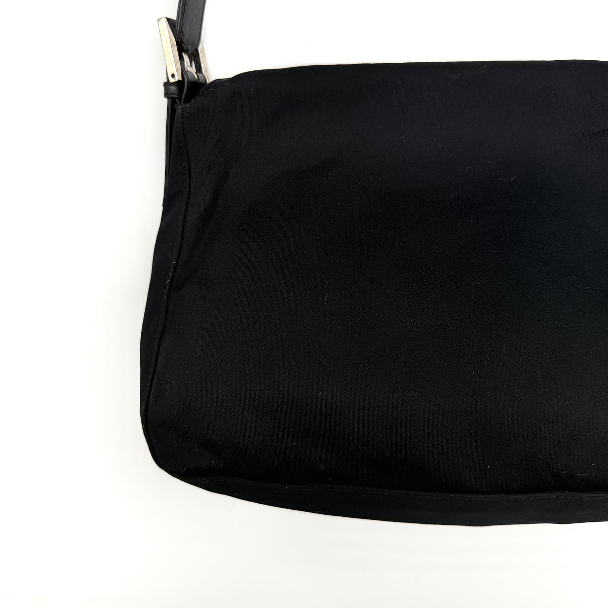 Fendi Mamma Baguette Shoulder Bag in black fabric with silver FF buckle and leather strap, photographed on a white backdrop.