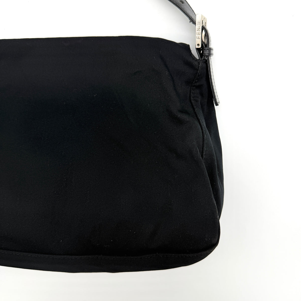 Fendi Mamma Baguette Shoulder Bag in black fabric with silver FF buckle and leather strap, photographed on a white backdrop.