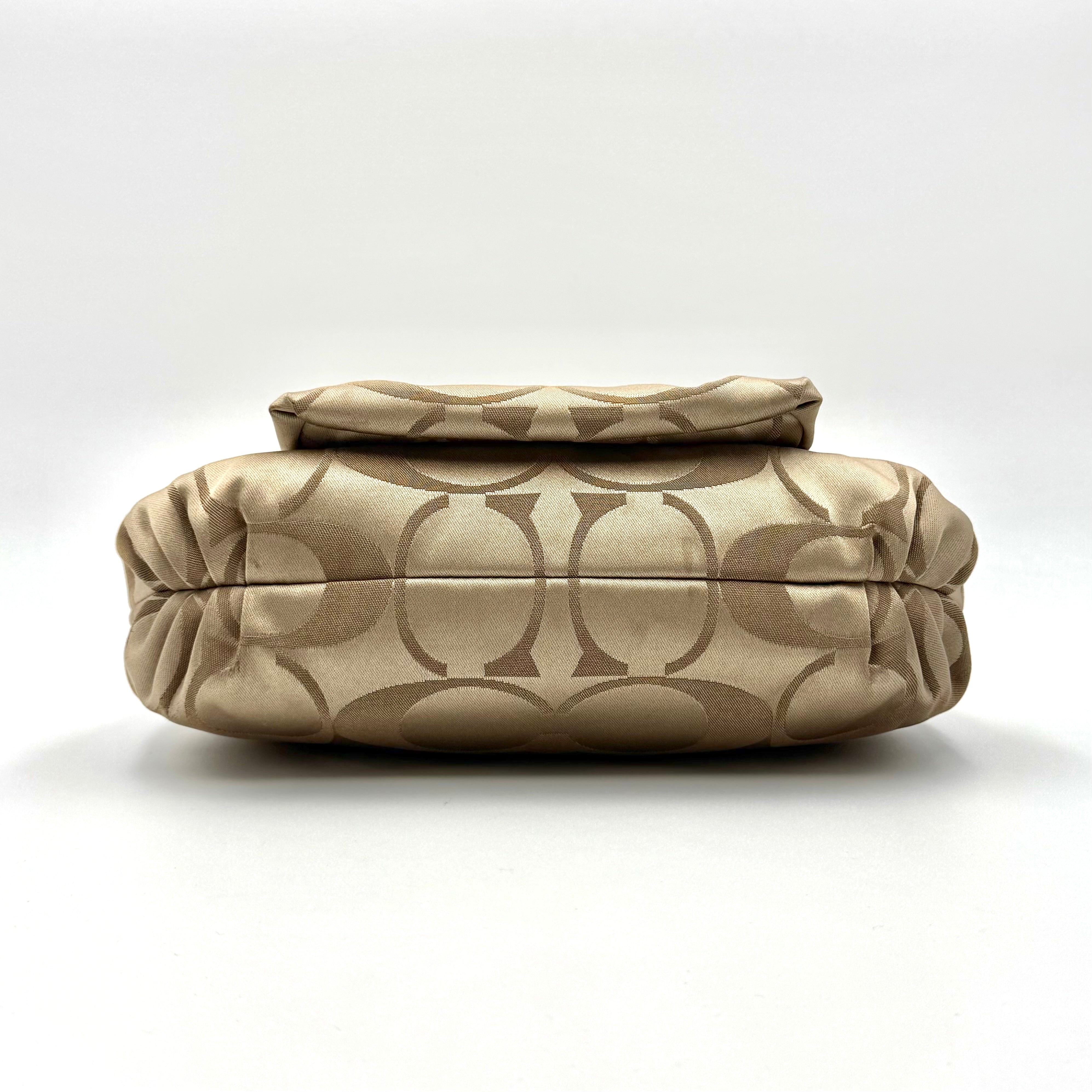Coach Signature Poppy Sateen Groovy Shoulder Bag in beige with pink trim and detachable strap, displayed on a white background.